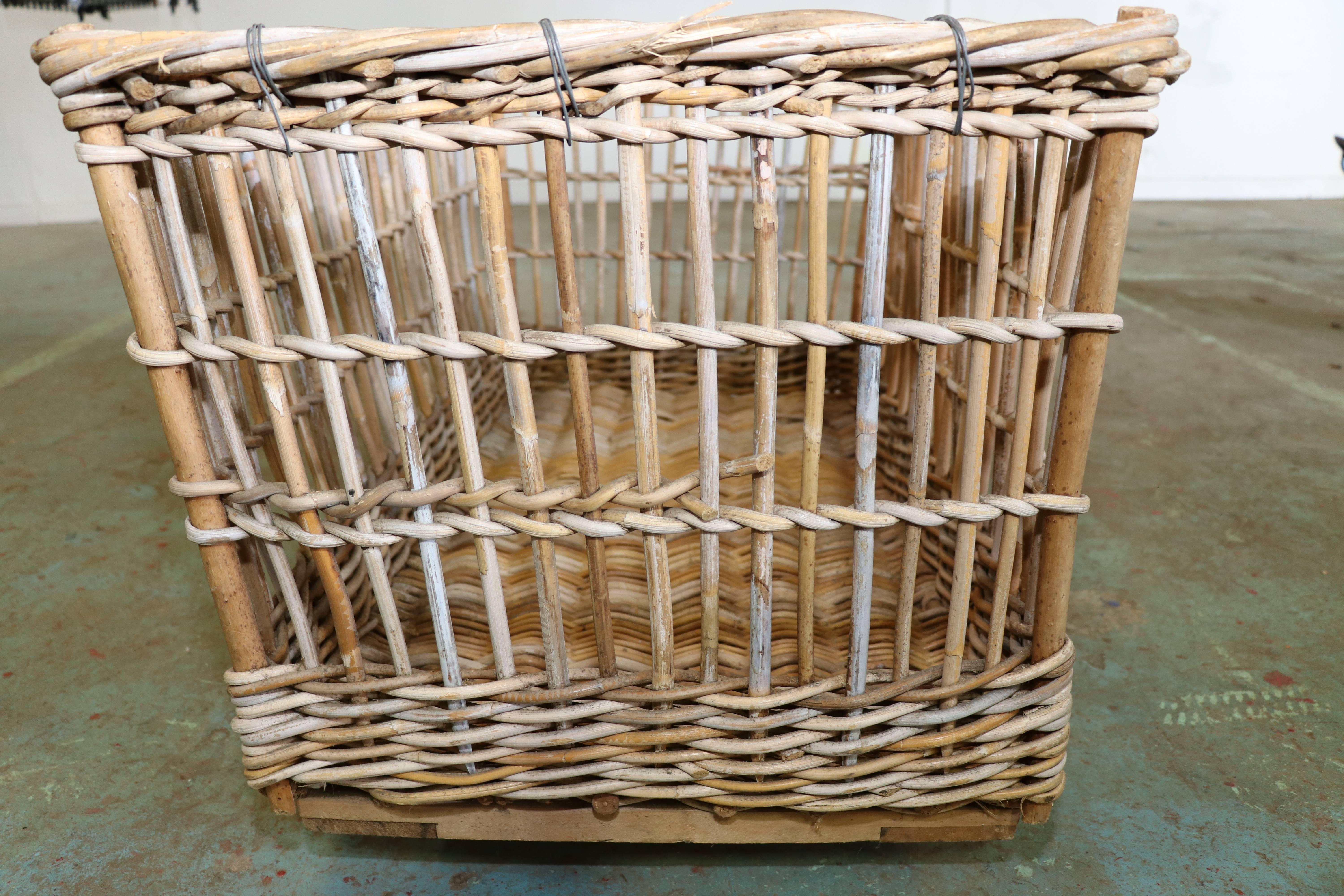 This large-scale wicker cart was used in a Belgian linen factory in the 1920s. The cart is on four wheels. Two carts available, which vary slightly. Price is for one cart.
