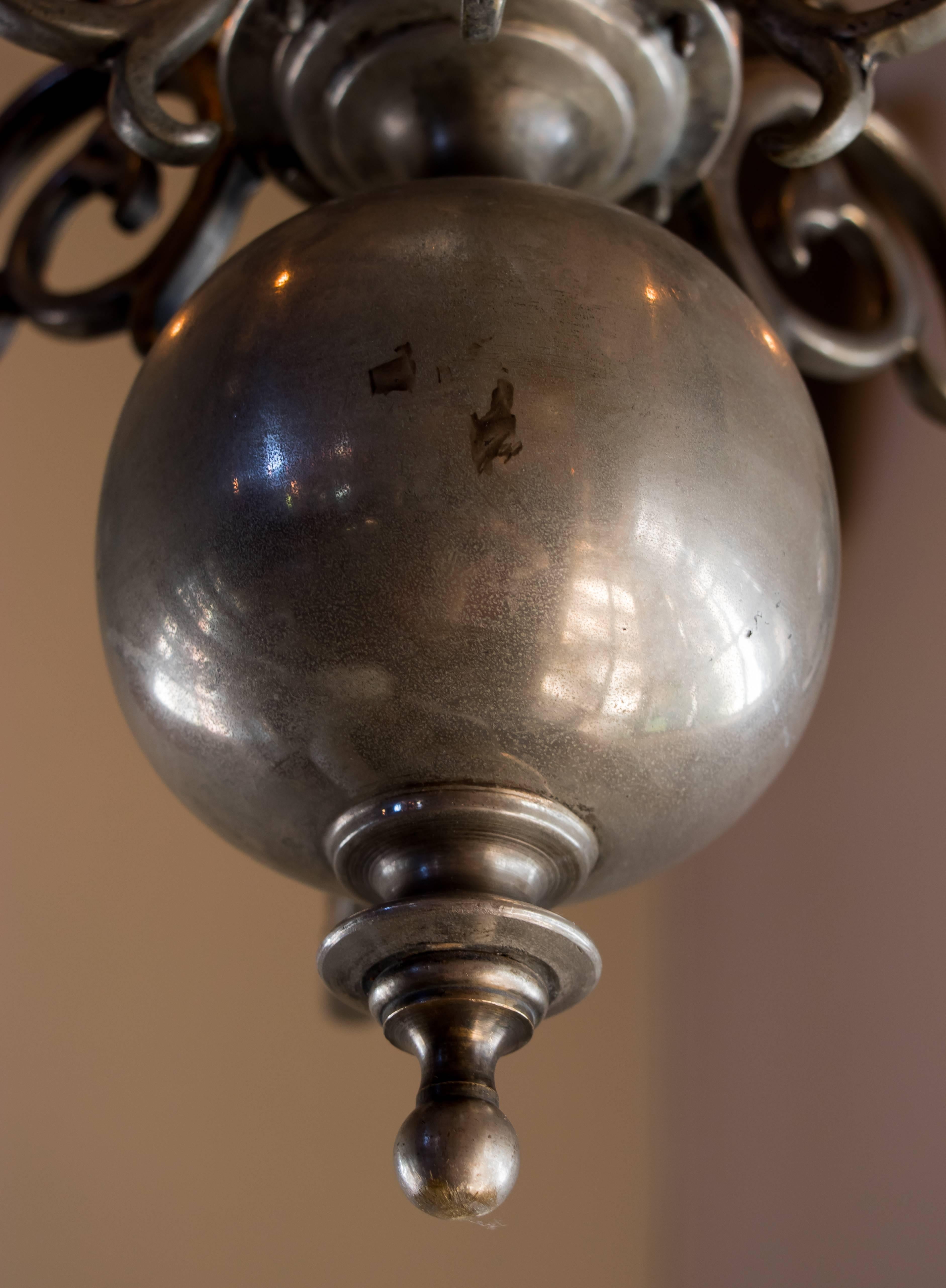 Georgian style classic chandelier with six arms. This nickel-on-bronze chandelier has a beautiful patina that has a bit of a pewter color, but is much harder and heavier than pewter. This vintage Flemish-style light is a true classic that has a