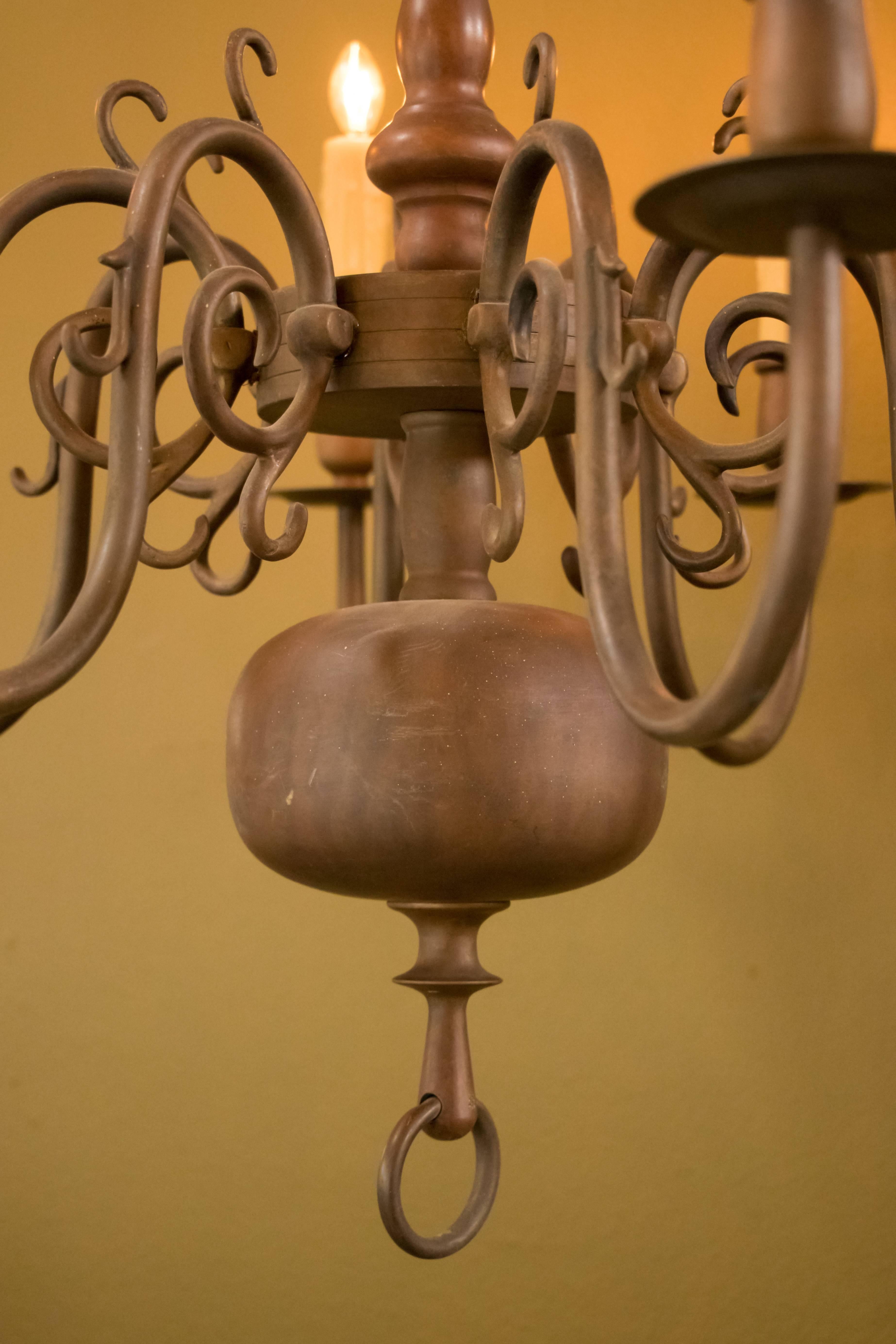 Classic heavy Georgian style bronze chandelier with beautiful squashed spherical bottom from Belgium (circa 1910). Beautiful warm brown aged patina on bronze. Newly wired for use within the USA with all UL listed parts and eight candelabra-size