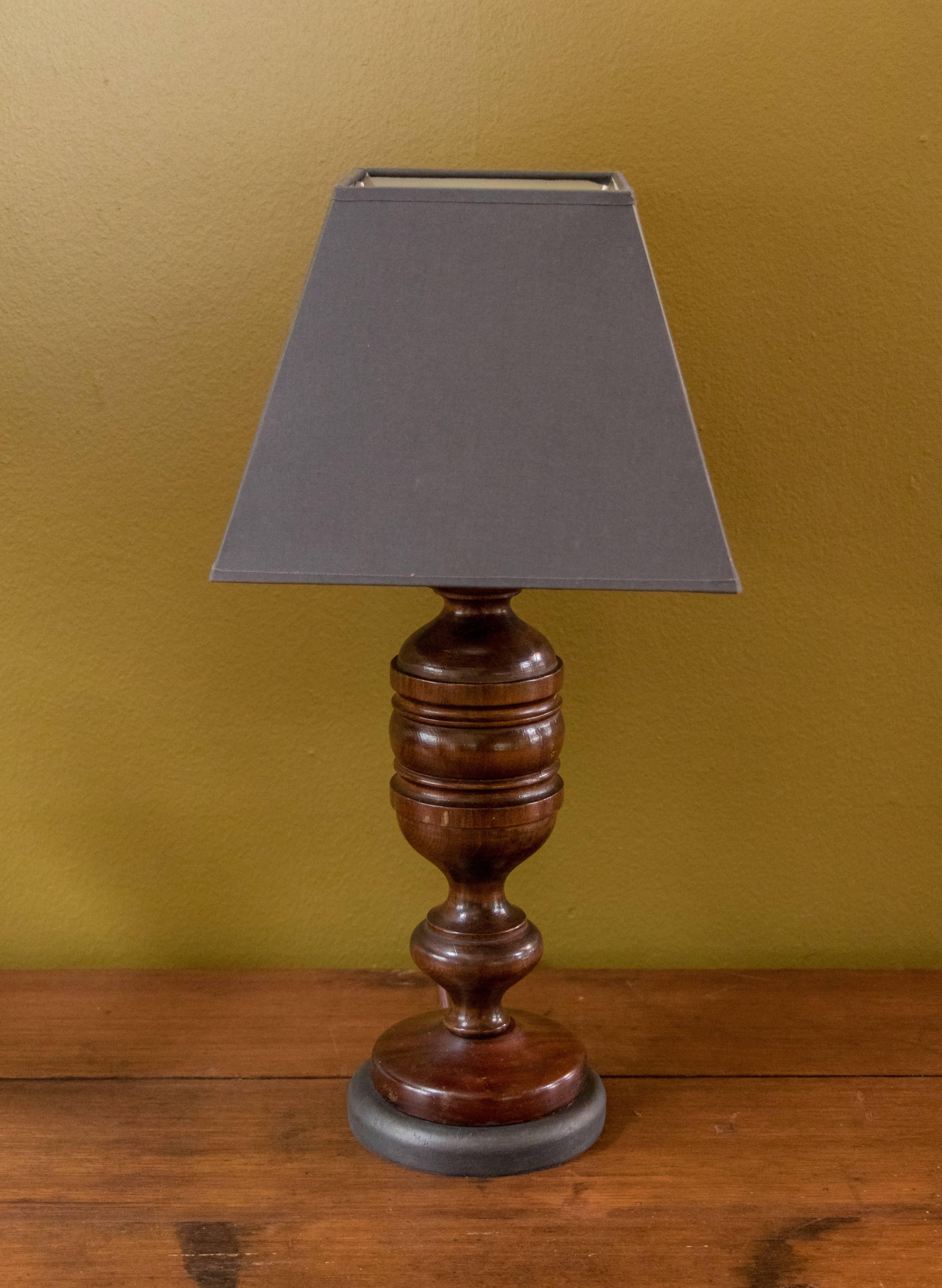Charming pair of dark mahogany wood hand-turned table lamps with painted dark grey wooden bases from Belgium, circa 1920s. Comes with two custom-made Belgian linen shades in a dark grey color. Perfect size for bedside lamps. Newly wired with all UL