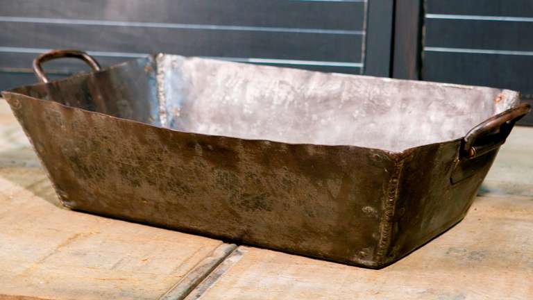 Handcrafted industrial metal trough from Hamburg, Germany. Likely dates from the 1930s. Nice patina and shape. The handles are hand-forged and beautifully made. A unique accessory that can be used as a planter with a liner (it is made of iron and