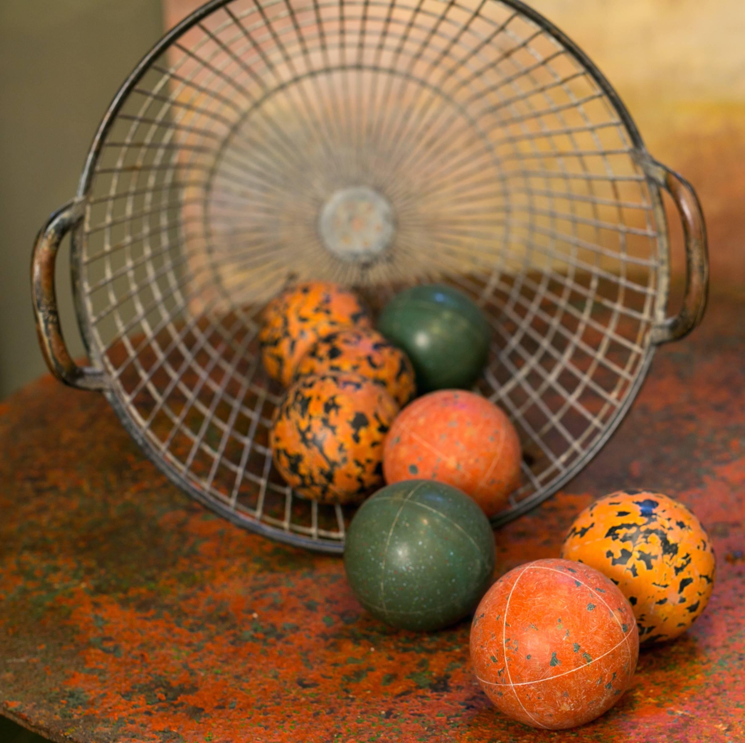 Collection of eight vintage Italian bocce balls. From Italy, circa 1950s. Beautiful colors and texture great tabletop décor. Basket sold separately.