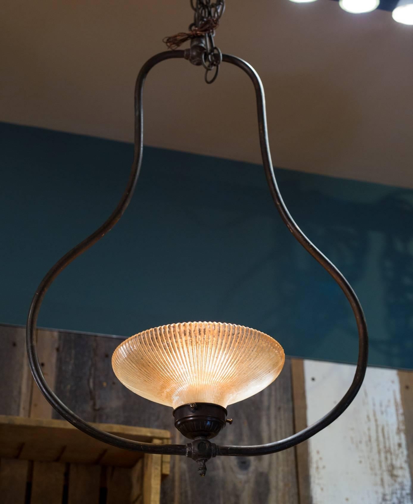 Beautiful, one of a kind pendant with brass body and antique pleated glass shade.  Newly wired in the US with one Edison socket and all UL approved parts. Comes with matching chain and canopy.