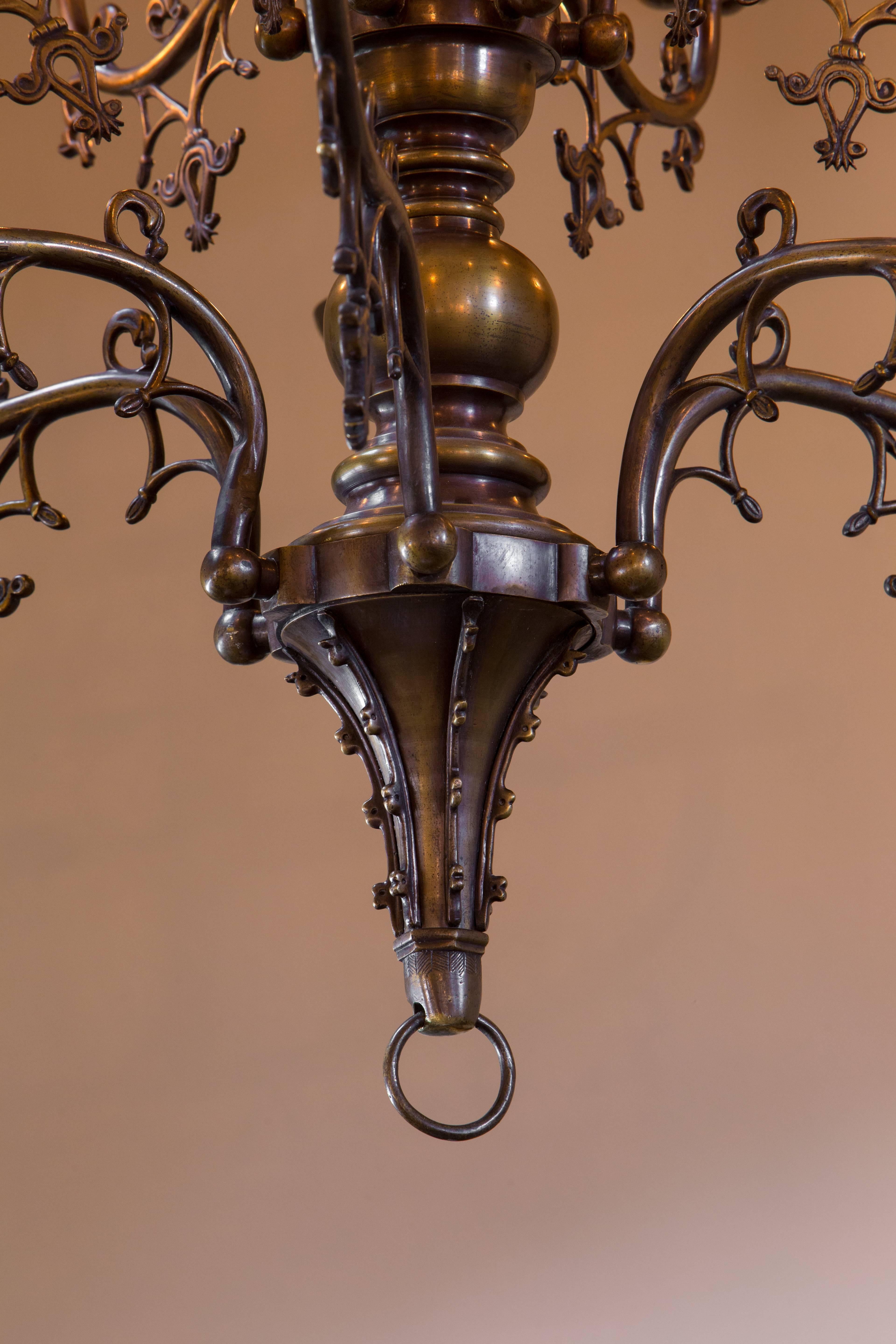 Antique bronze Gothic Revival chandelier from Belgium, circa 1900.
Gorgeous casting, patina and detailing.
Newly rewired in the USA with all UL listed parts and 12 candelabra sockets. Comes with matching chain and canopy.
 