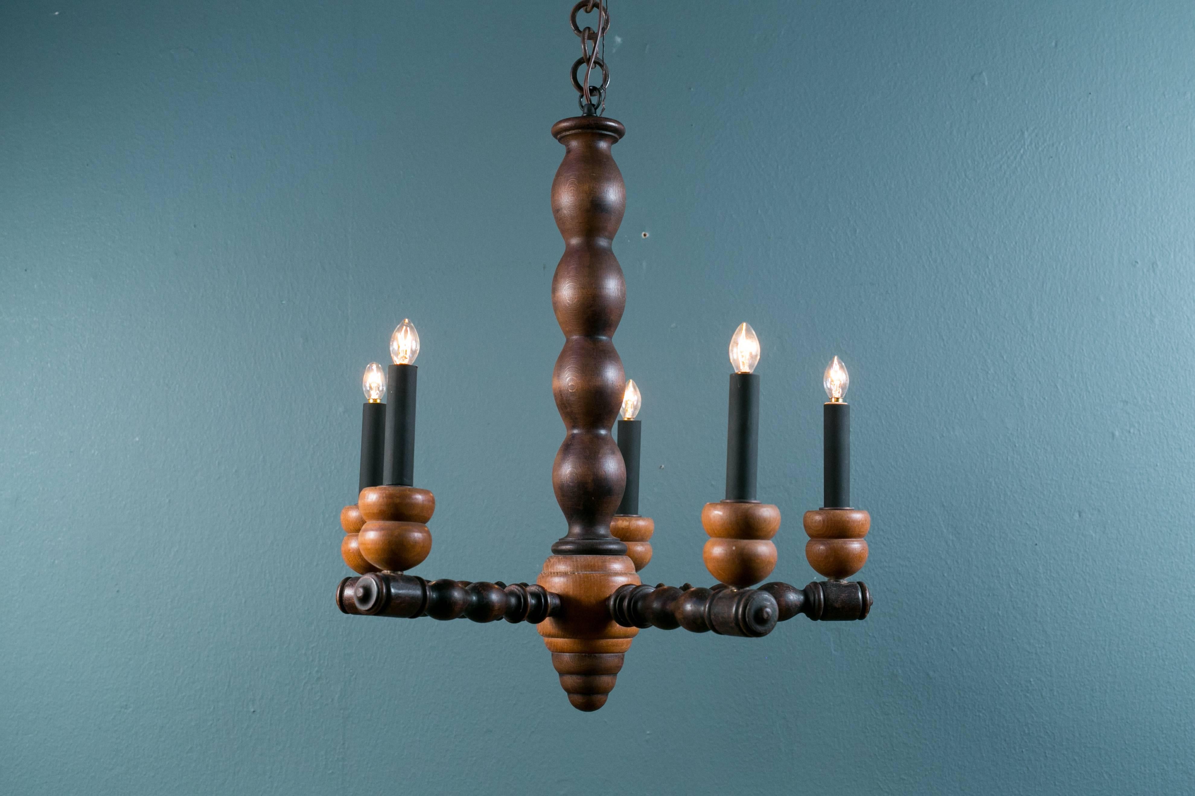 Three-toned, bobbin turned wood chandelier with five arms from England. Charming, primitive country style vintage light.  Newly rewired in the USA with all UL approved parts, handmade iron chain and a hand-made iron canopy.  Your choice of white or