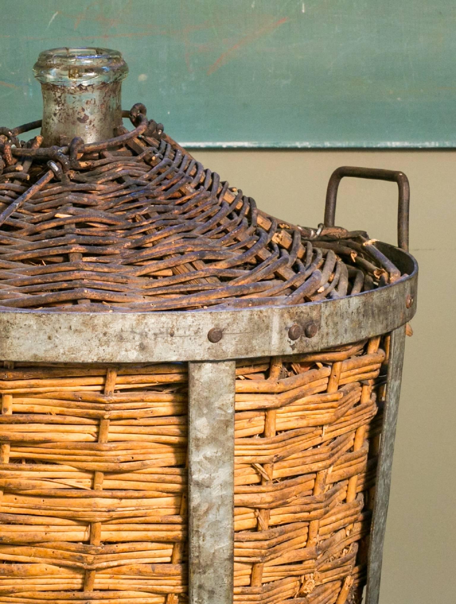 Charming rustic antique bottle in it's original rattan and metal basket. Full of character with a wonderful patina. Would be perfect for a vineyard, wine room or cellar.