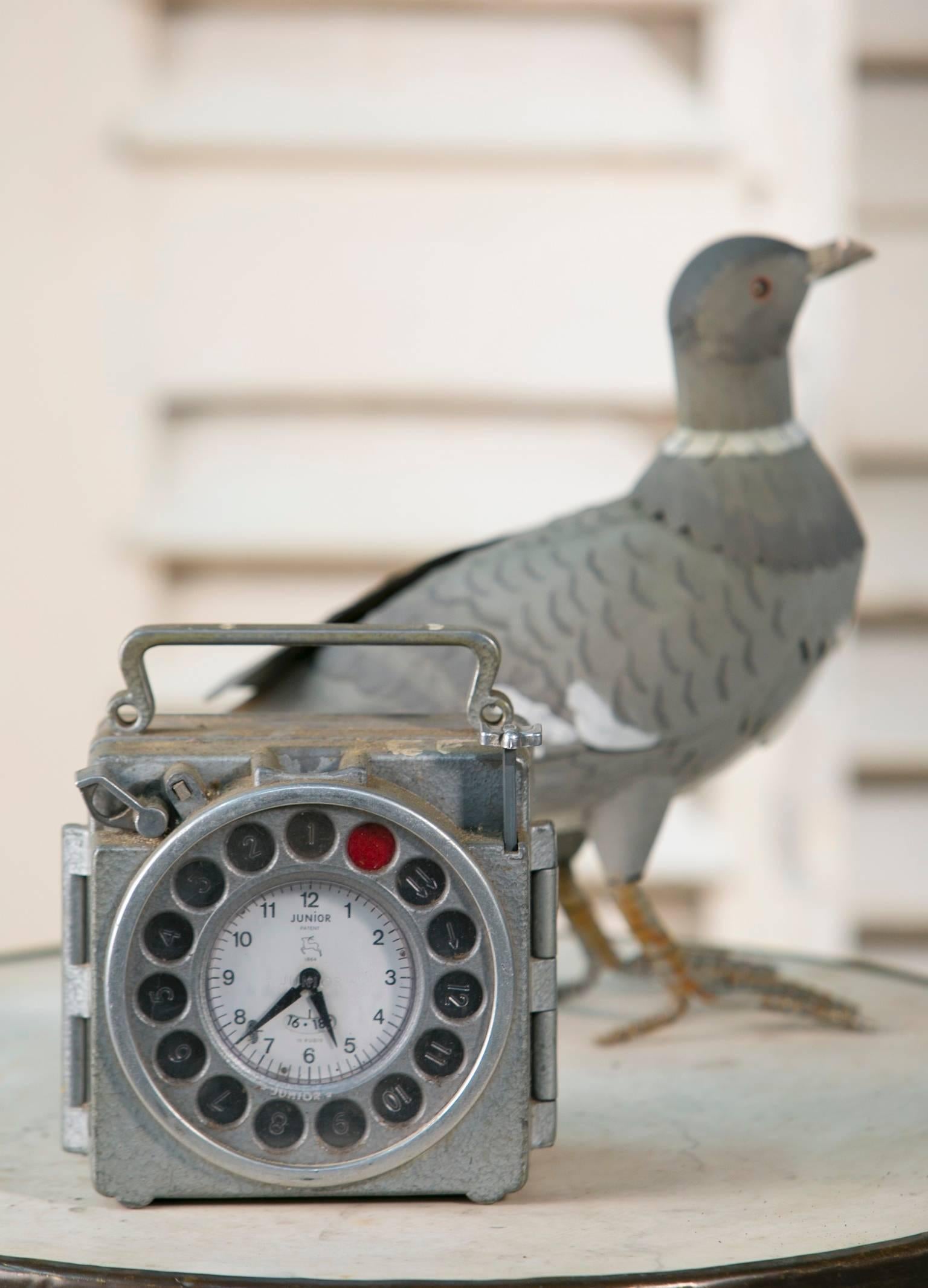 Vintage clock by Junior, from Antwerp, Belgium. Used for timing pigeon races. 
Multiples available. Price is for one.