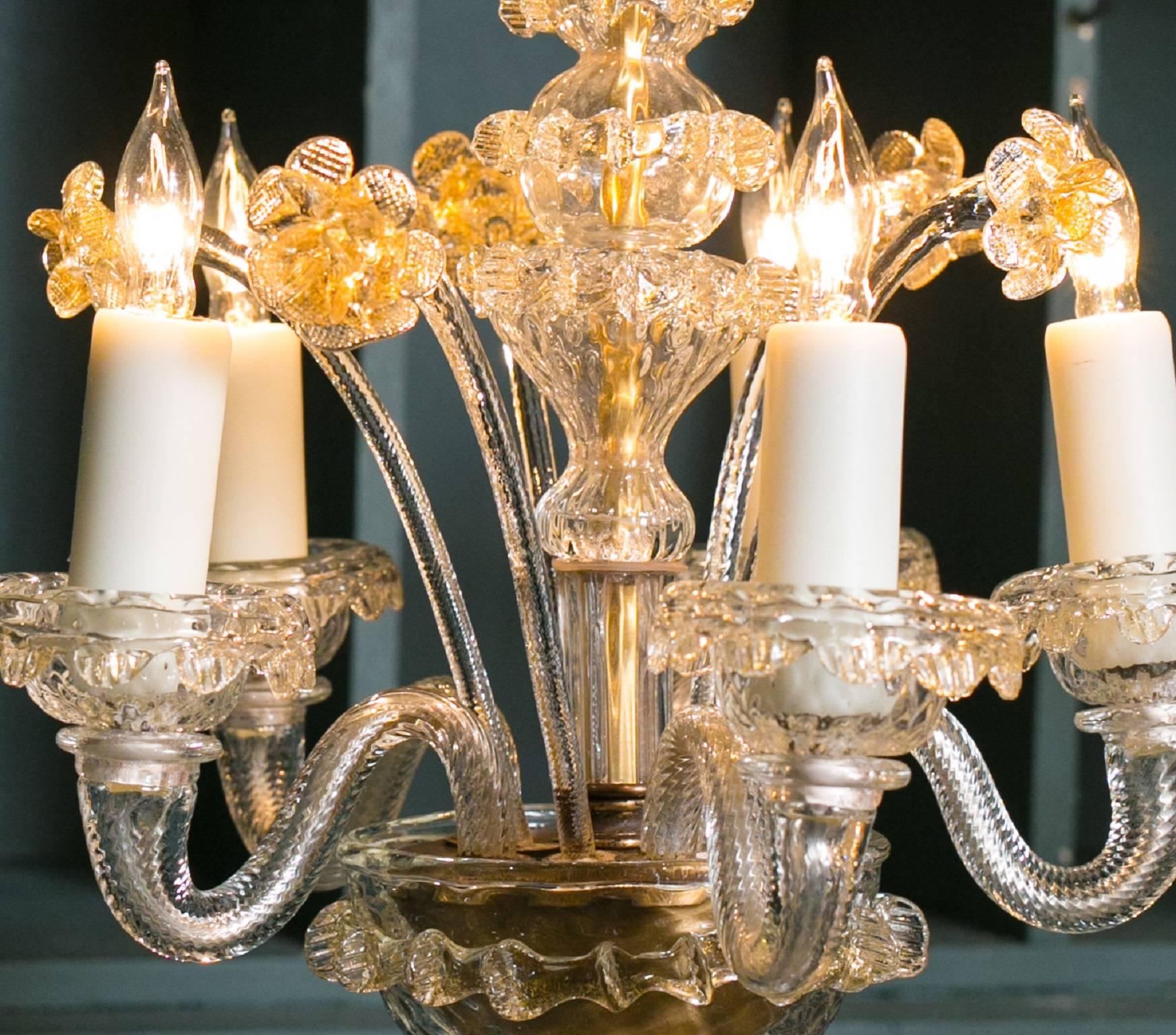 Charming, petite hand-blown glass chandelier from Murano, Italy, circa 1940. In the Aventurina style with clear glass and gold flecks  Comes with all original parts and flowers. Newly rewired in the USA with all UL listed parts and five candelabra