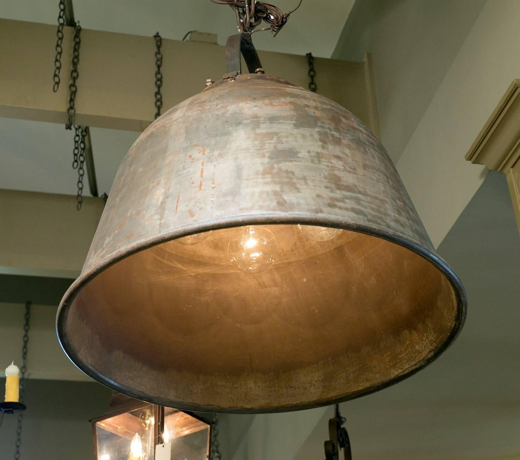 One of a kind, very heavy oversized vintage factory light from Belgium, circa 1950. Beautiful patina. Newly wired in the USA with all UL approved parts and four internal porcelain Edison sockets on a drop down cluster. Comes with unusual handmade