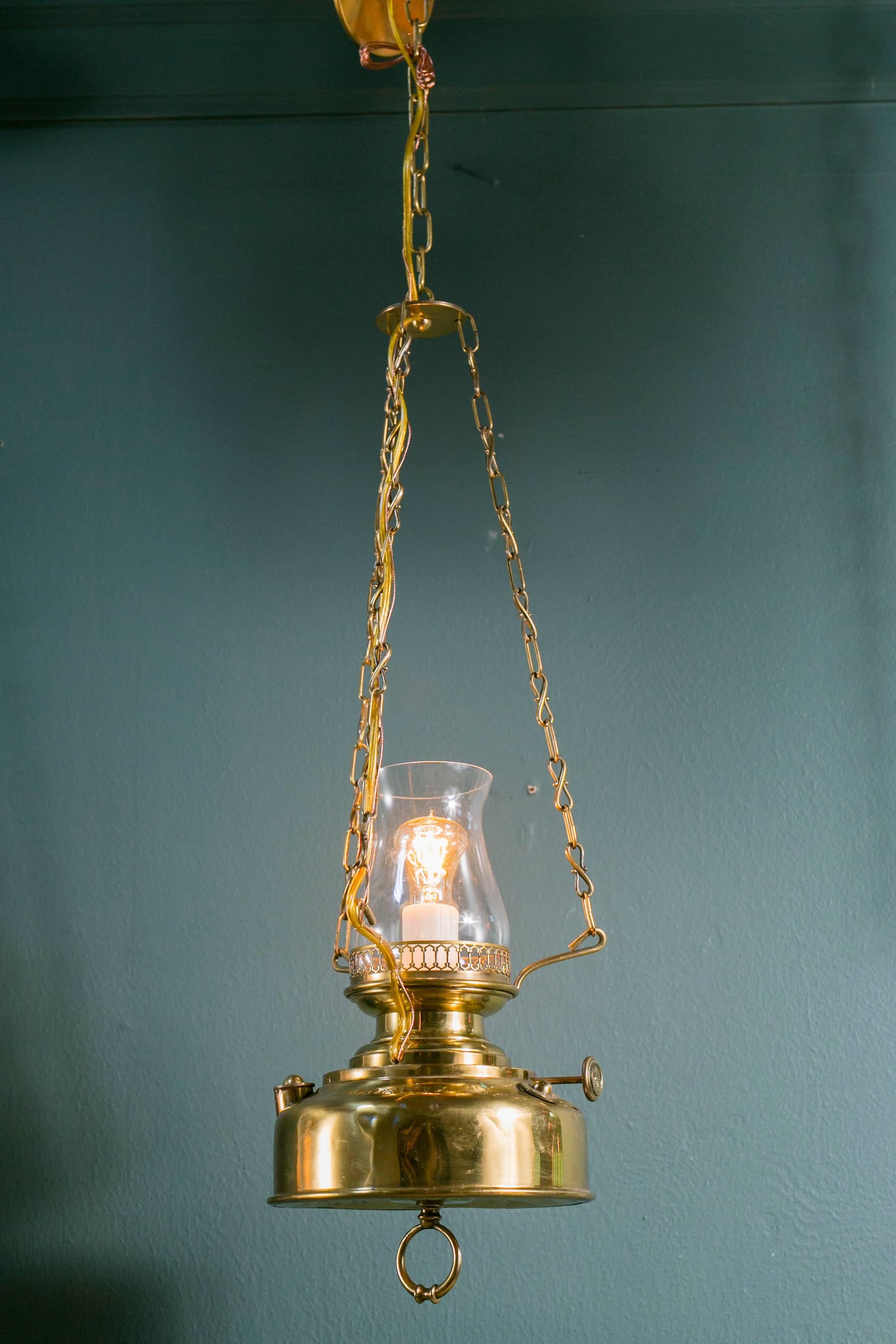 Wonderful brass lantern with blown glass hurricane, originally used as a kerosene lantern. Stamped with the Hasag mark and the name Calorifix on the top. HASAG (also known as Hugo Schneider AG, or by its original name in German: Hugo Schneider