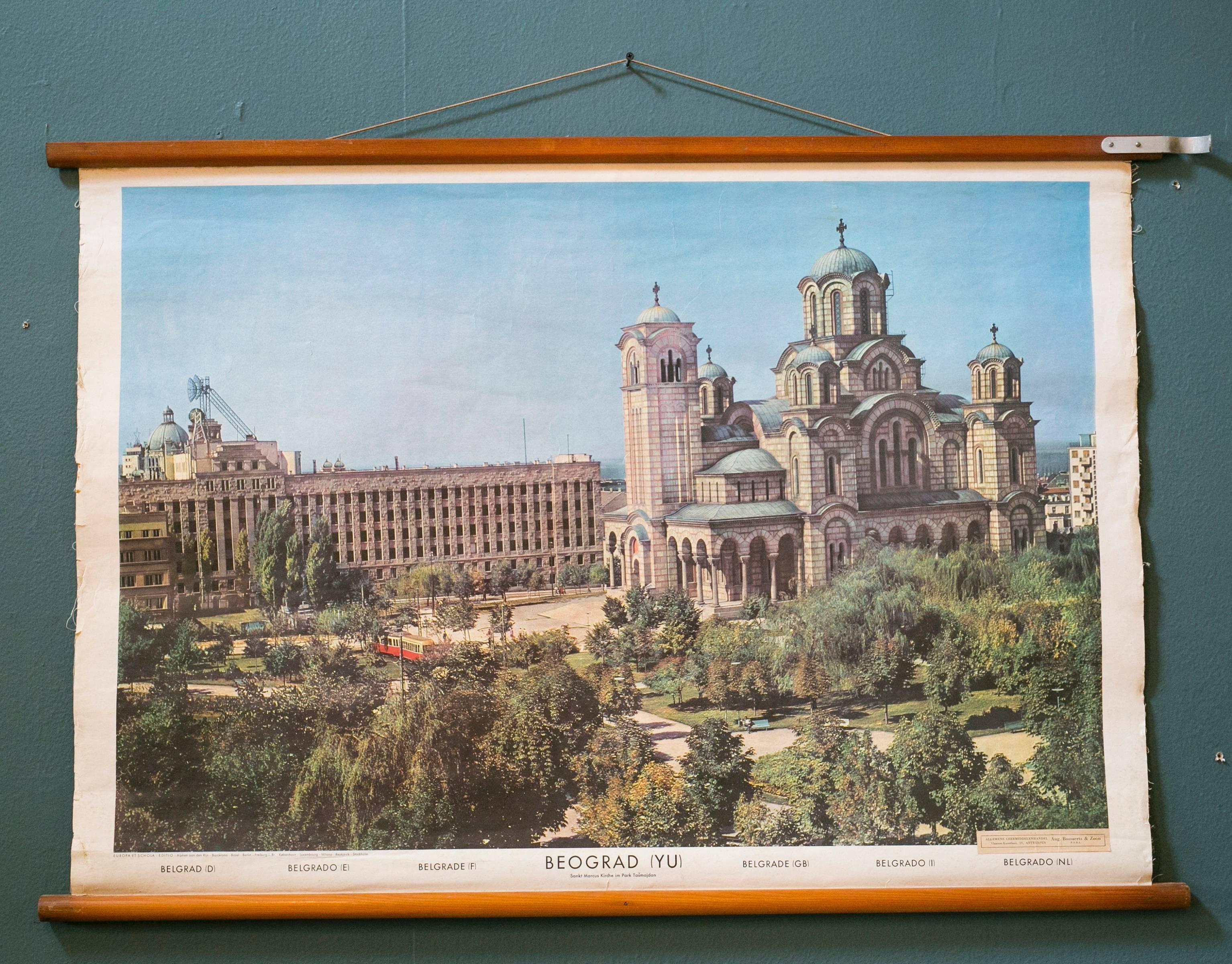 Collection of  large, roll-up vintage teaching charts on linen backed paper with original wooden dowel rods. Dated 1956. Pictures portrait the era nicely. Used in a Belgian school house. Features the cities of Warsaw, Belgrade and Vaduz. From the