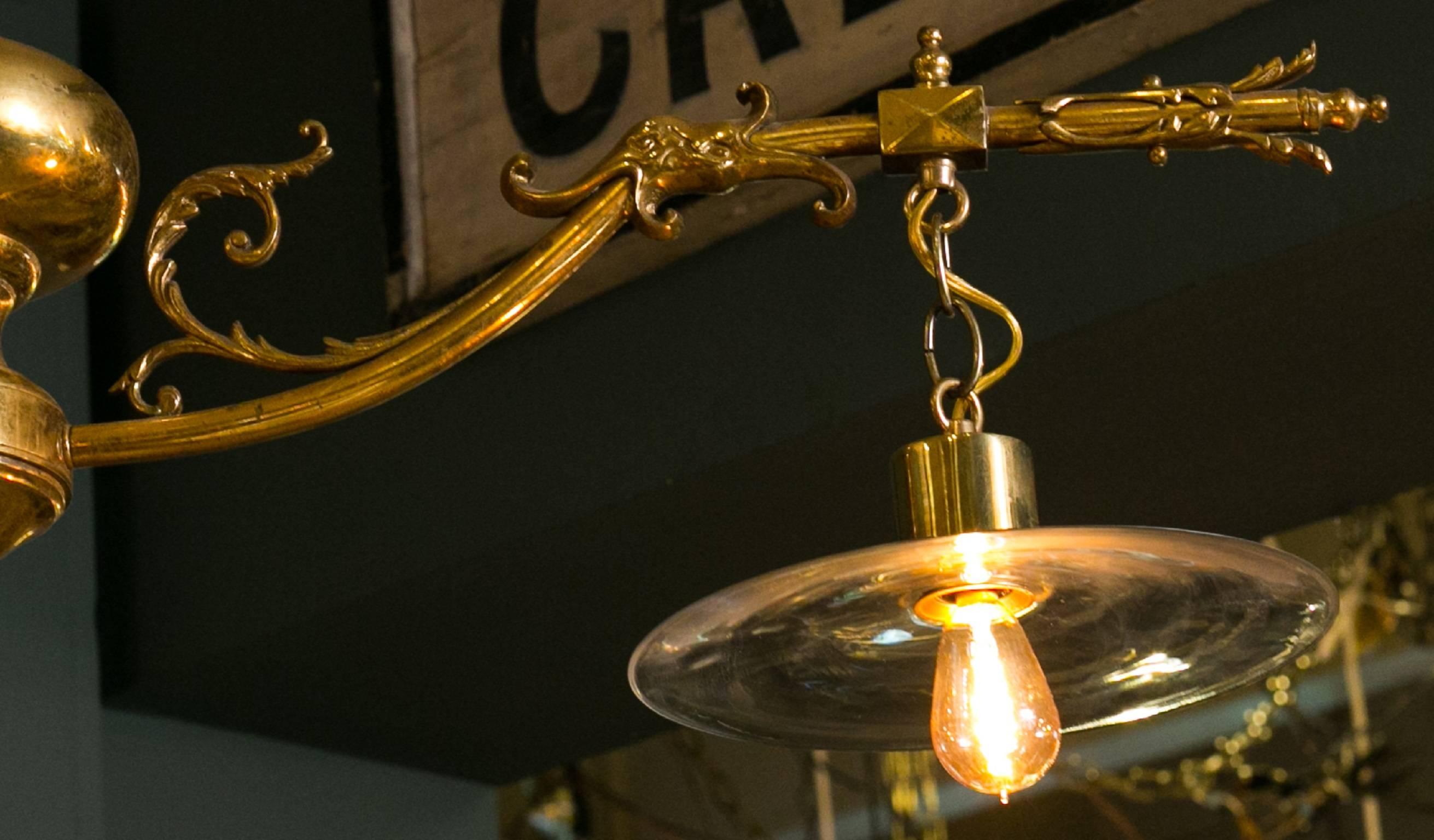 One of a kind vintage Belgian decorative brass light with two clear blown glass shades. Beautiful detailing on the casting. Newly rewired with all UL listed parts and two candelabra sockets. Would be great for an island.