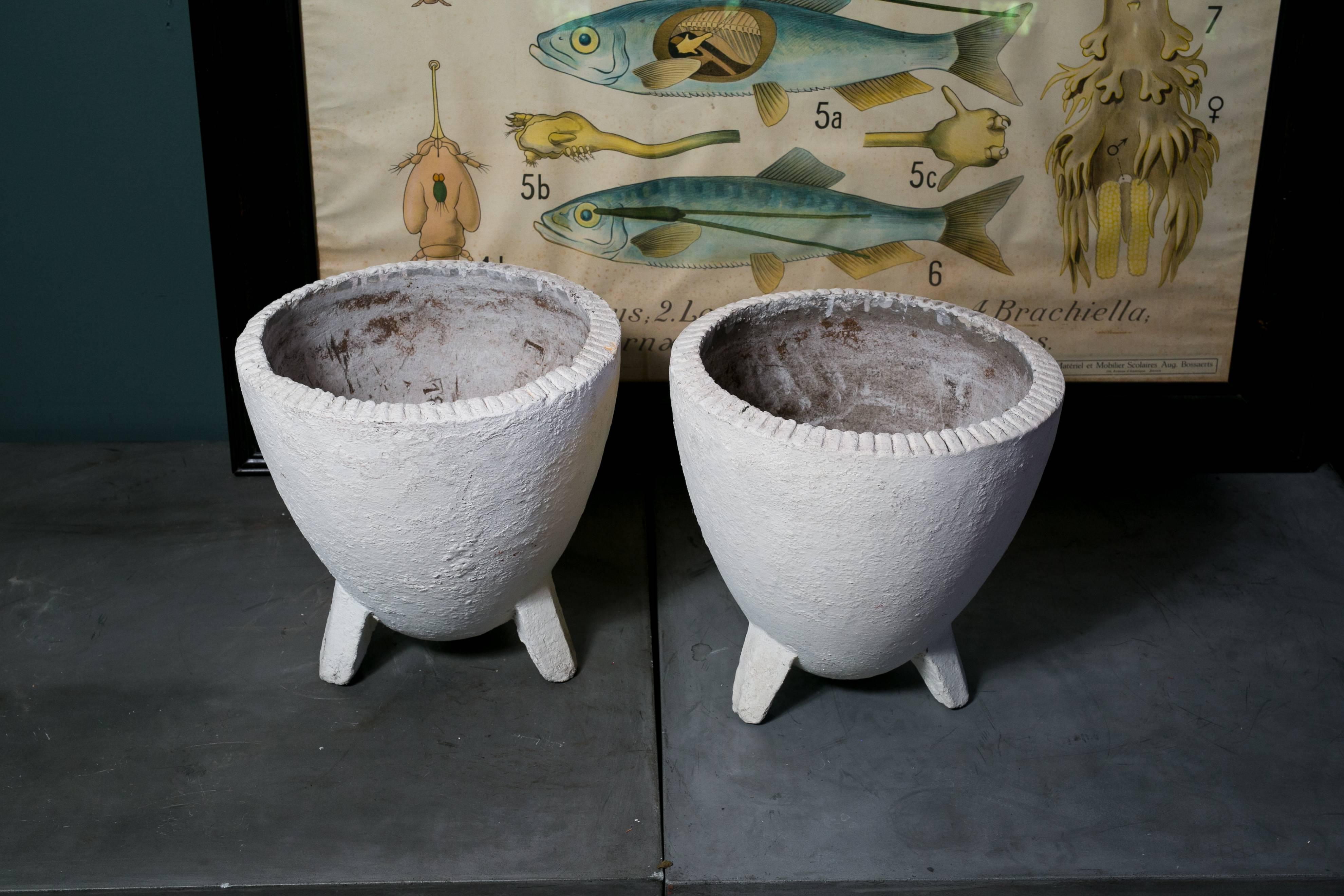Matching pair of fiber cement planters with three legs in the Mid Century Modern Style. Serial numbers are stamped inside each. Price is for the pair.