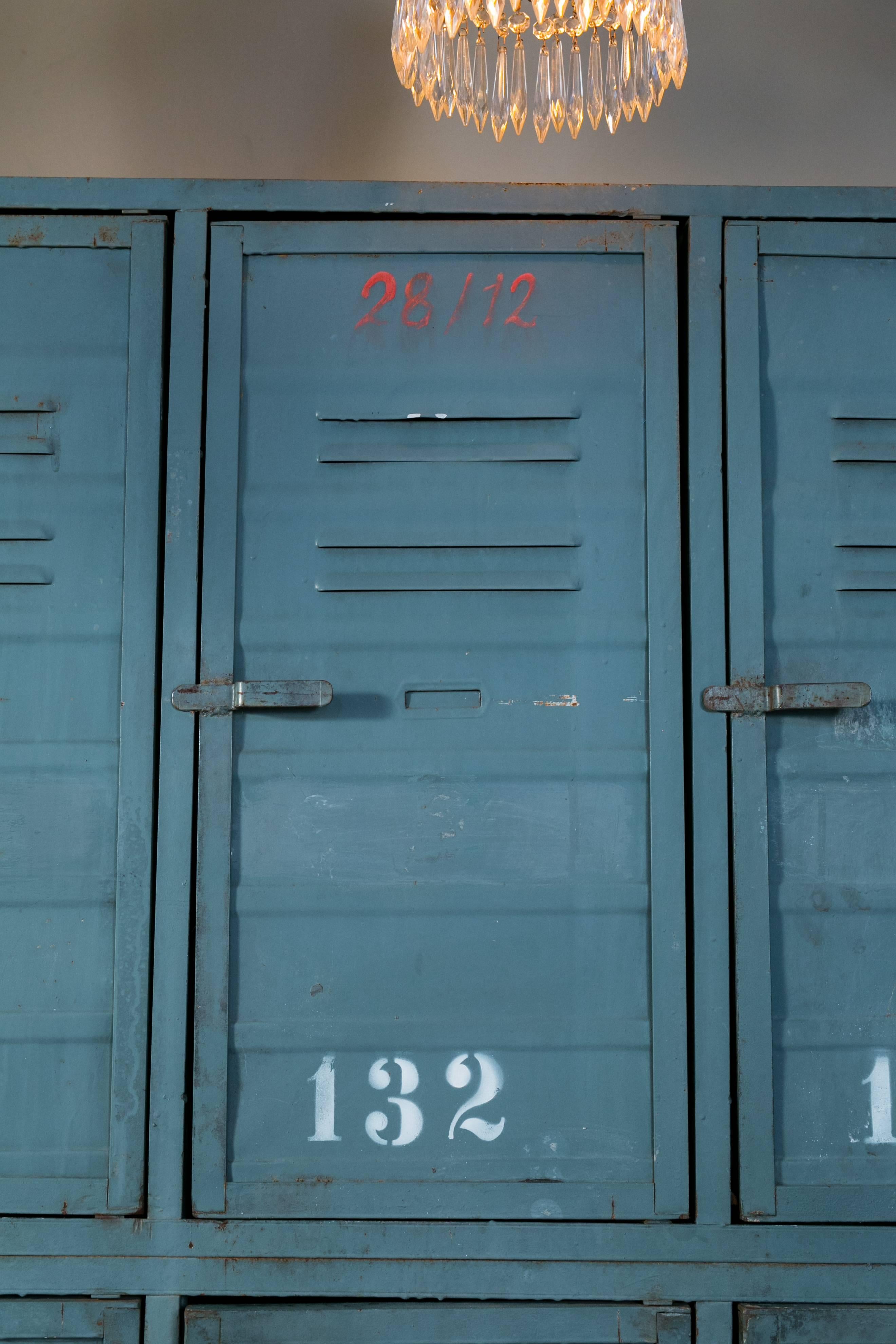 Blue-gray painted Industrial locker with two tiers and six doors in it's original condition. Top three lockers feature the original stenciled numbers with white paint. Locking mechanism (for top lockers) accessible from the bottom lockers. Bottom