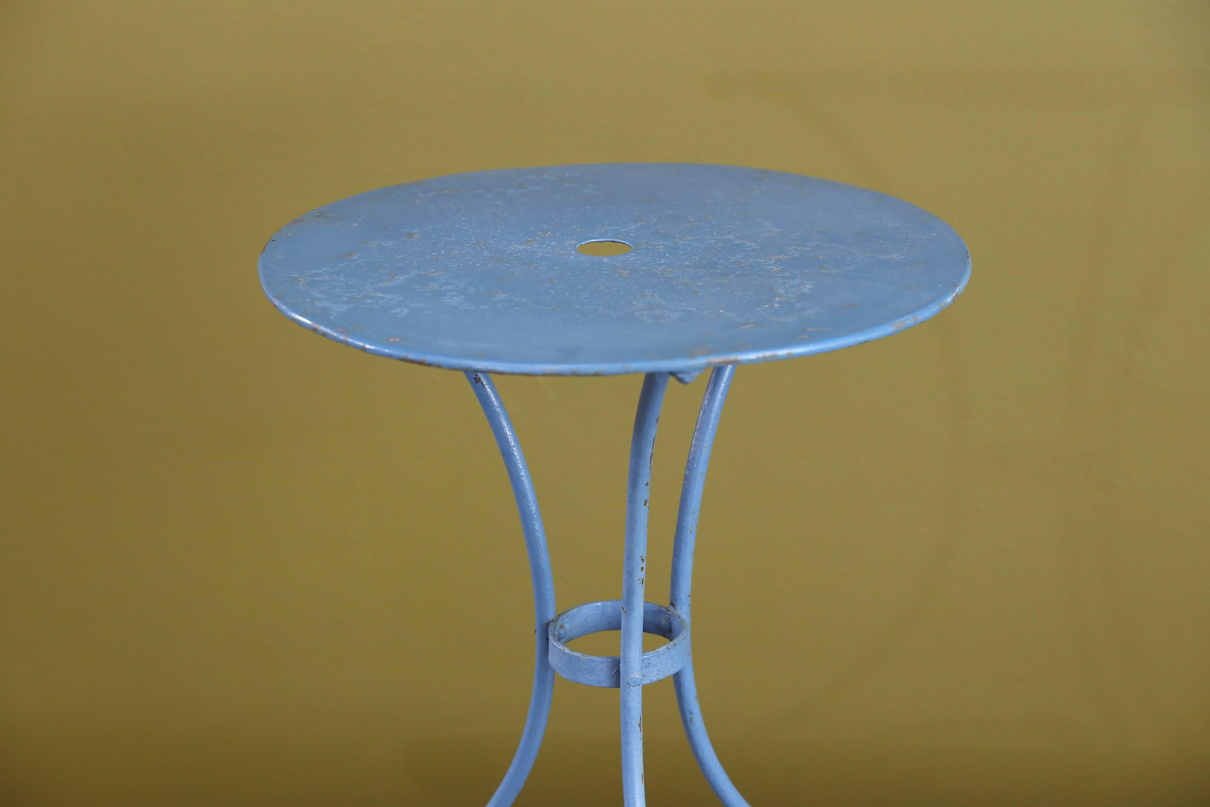 Vintage metal bistro table from France, circa 1960. Original blue paint and parts. Would make a great bedside table.