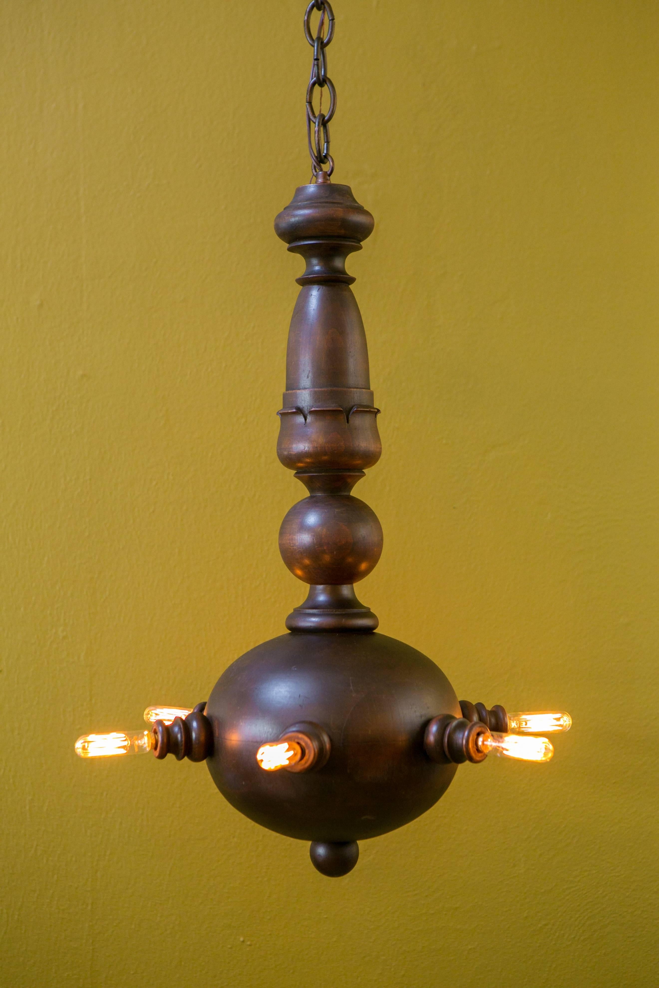 Unusual carved wood ceiling light from France, circa 1930. Built like a piece of furniture and handcrafted from oak. Features six candelabra sockets, newly wired with all UL listed parts. Comes with tube shaped filament bulbs. Diameter listed is for