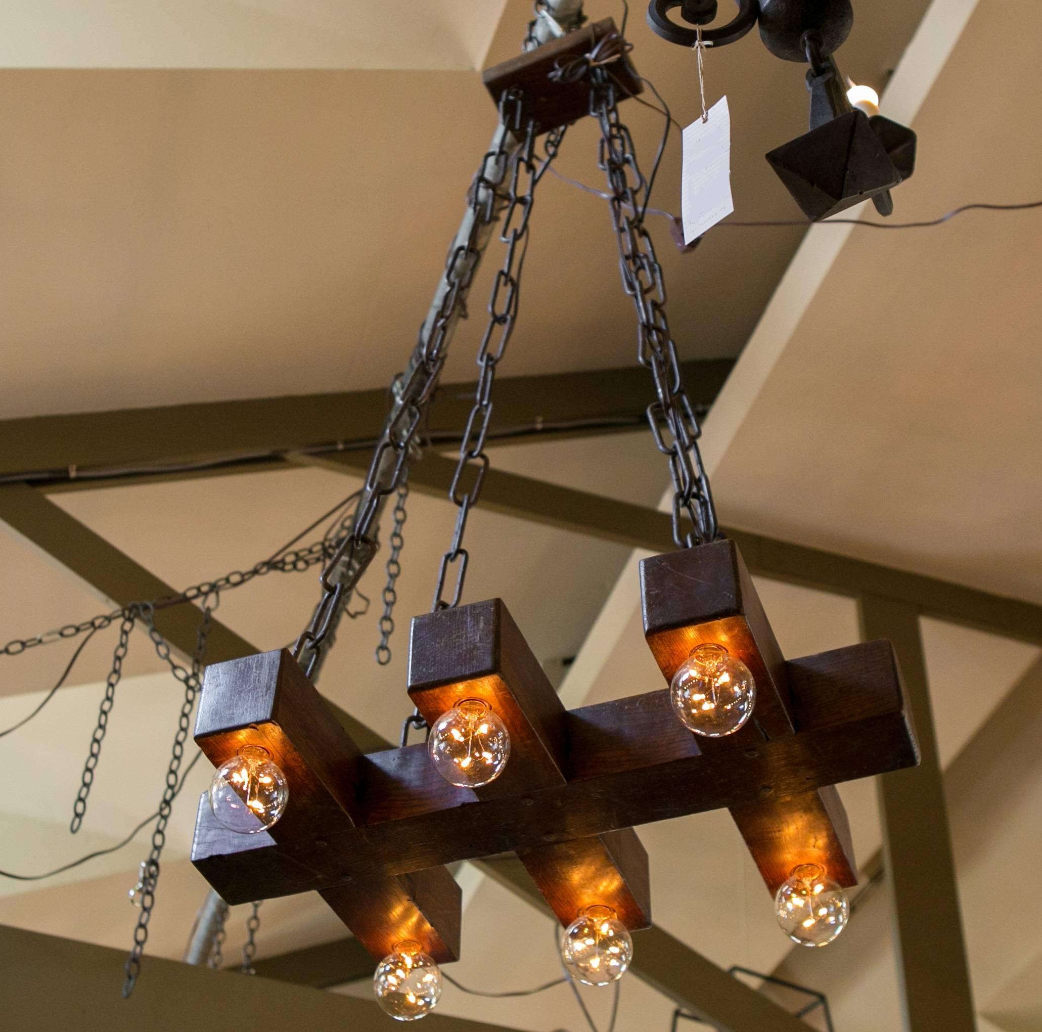 One of a kind, handcrafted wood light with large link custom iron chain and wooden canopy. From Belgium, circa 1940. Newly wired with all UL listed parts and six porcelain Edison sockets. Measurement listed is for wooden part only, without the
