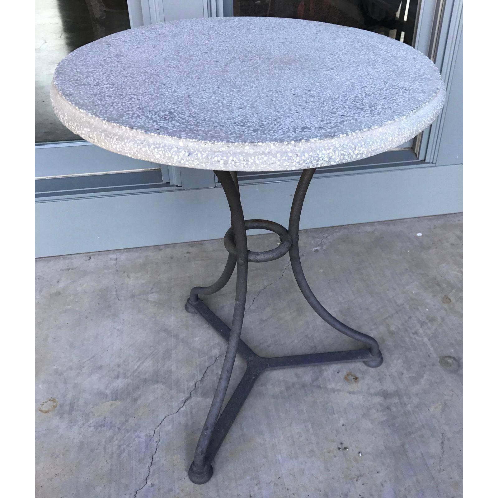 Pair of heavy, painted black iron base bistro tables with terrazzo tops. From Belgium, circa 1960. Good for kitchen, garden, or side tables. Price is for the pair.