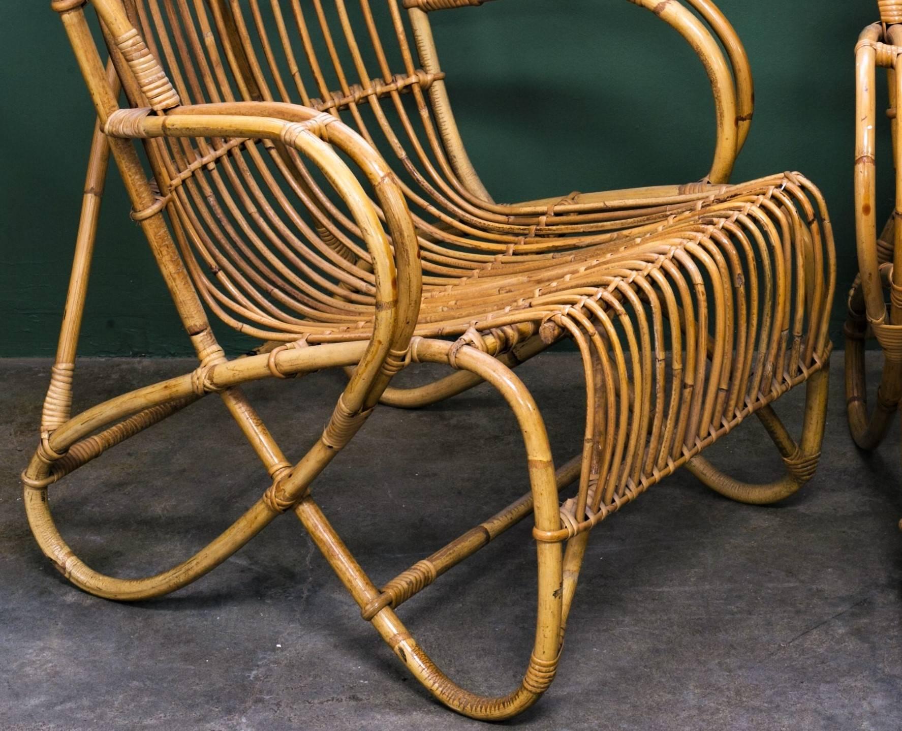 Vintage tortoise bamboo and rattan low arm chairs, circa 1950s. Designed by Dirk van Sliedrecht for Rohe Noordwolde. Similar to the style of Franco Albini. Beautiful lines and clean wicker- like design. For indoor use. Measurement listed is for one