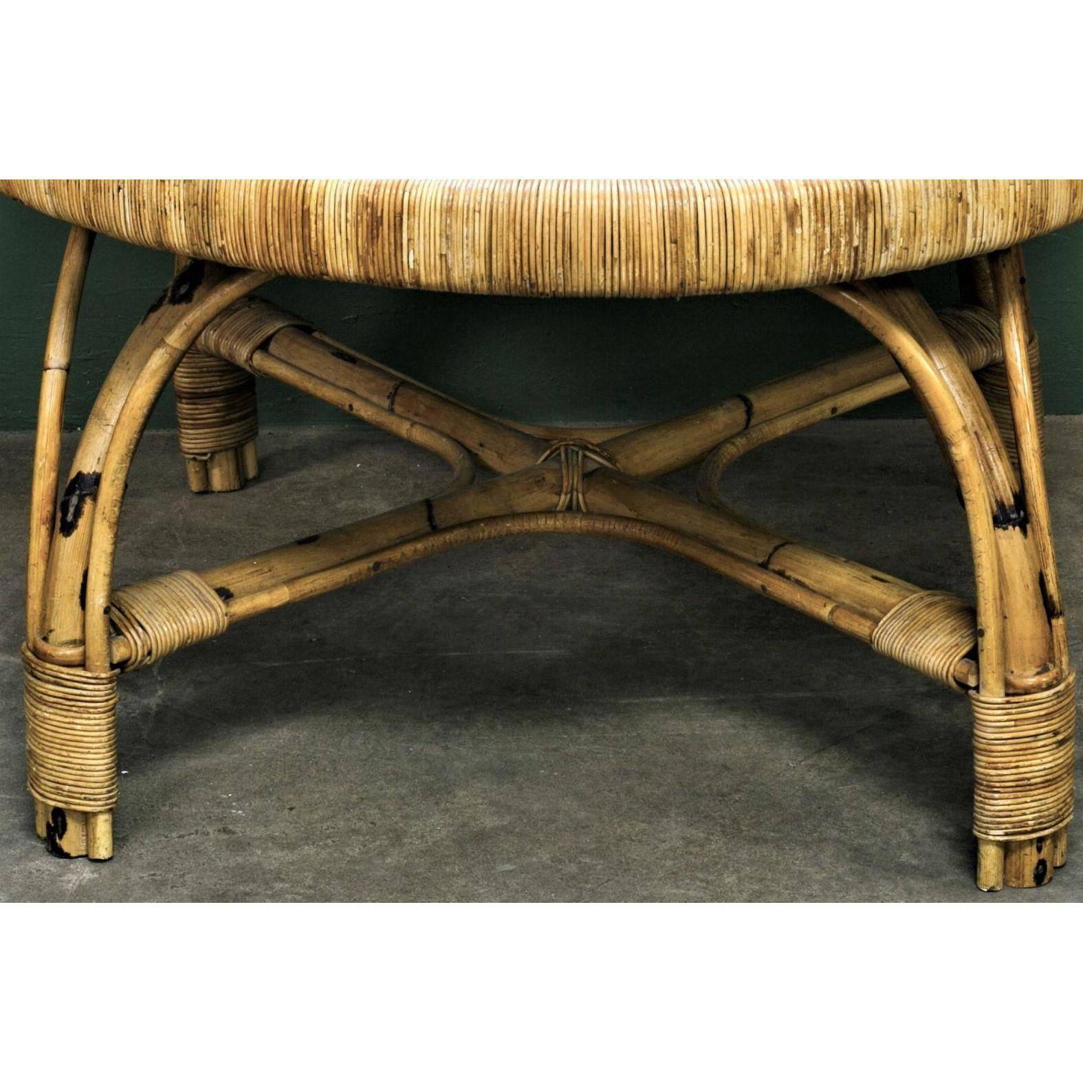 Vintage tortoise bamboo and rattan coffee table with black glazed tile top. From France, circa 1950.  Wrapped wicker style banding around the top and on the legs. X-frame stretcher connects the four curved legs. Diameter listed is for the legs. Top