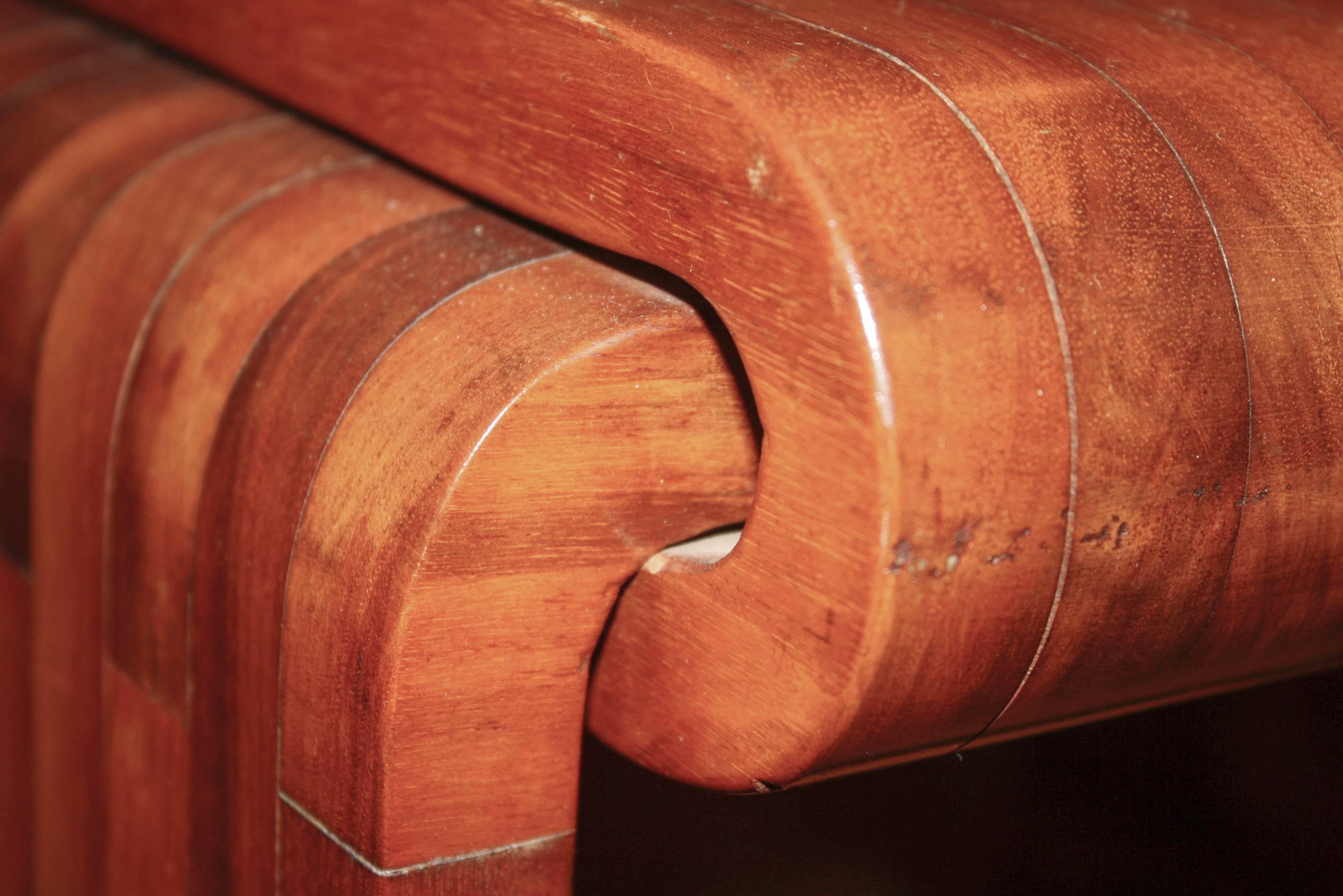 Vintage side table of laminated wood veneer pieces.