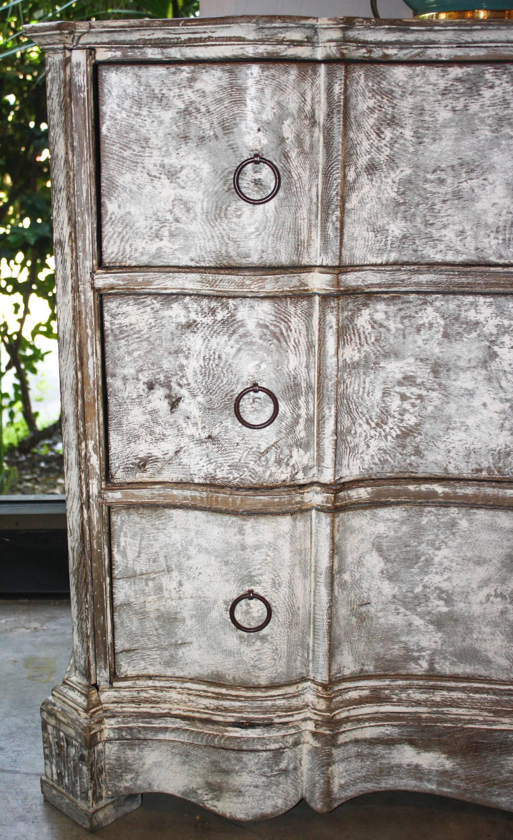19th century three-drawer chest, serpentine front with scraped finish.