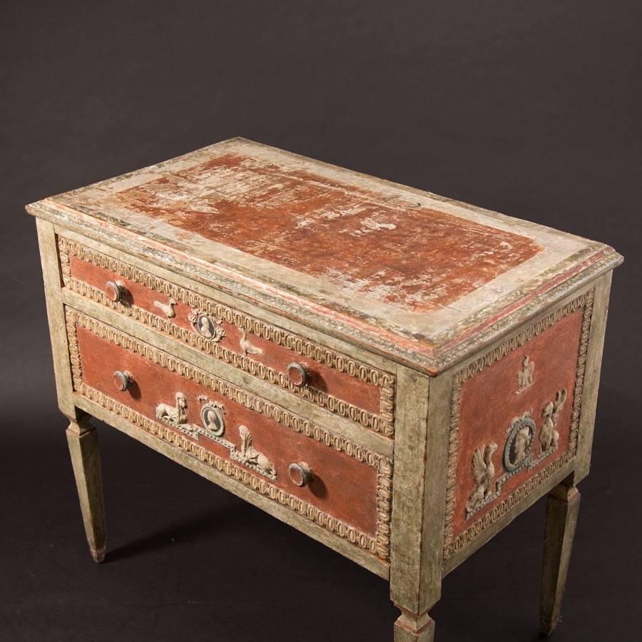 19th century painted Italian commode in the neoclassic taste. Decorated with medallions and Sphinx, circa 1830. Original paint showing typical wear. Decoration all in plaster.