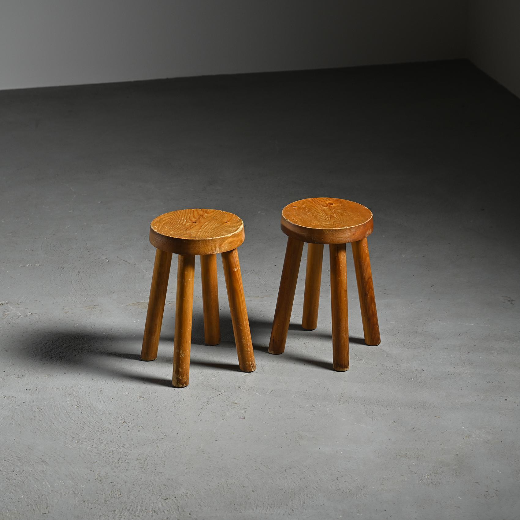  Pair of pine stools designed by Charlotte Perriand for the Les Arcs ski resort in the French Alps, circa 1965.

Created for the mountain apartments, these iconic pieces combine rustic simplicity with structural efficiency. Each stool features four