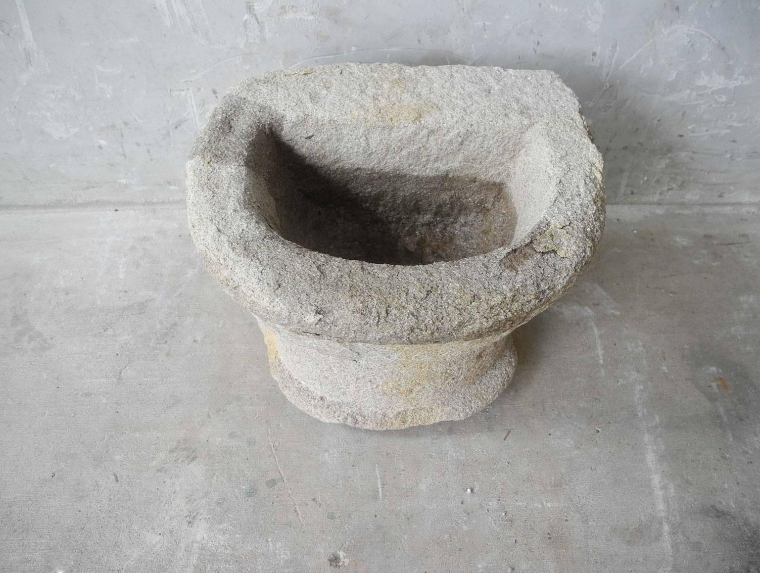 This is tiny and lovely 17th century antique baptismal font (benetier) stone element from a church near Uzes, France. It is so small it can be used to hold a small plant or to display as decor as well. It has a remarkably historical feel and would
