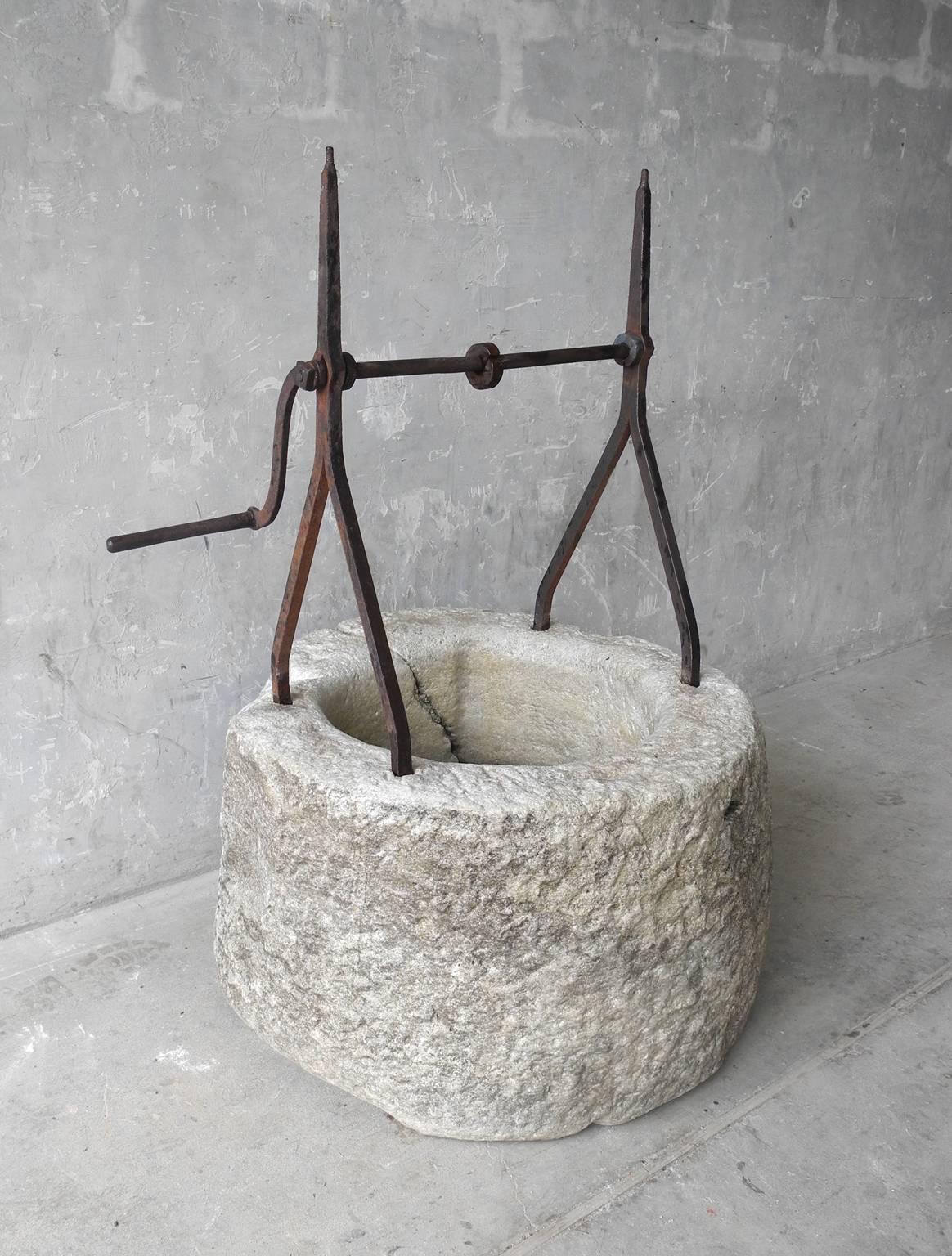 This is a small and darling antique 17th century stone well from the courtyard of a house in Imola, a town in the Emilia-Romagna region of Italy. It is elegantly simply and makes for a wonderful addition to any garden space. It has a sturdy and