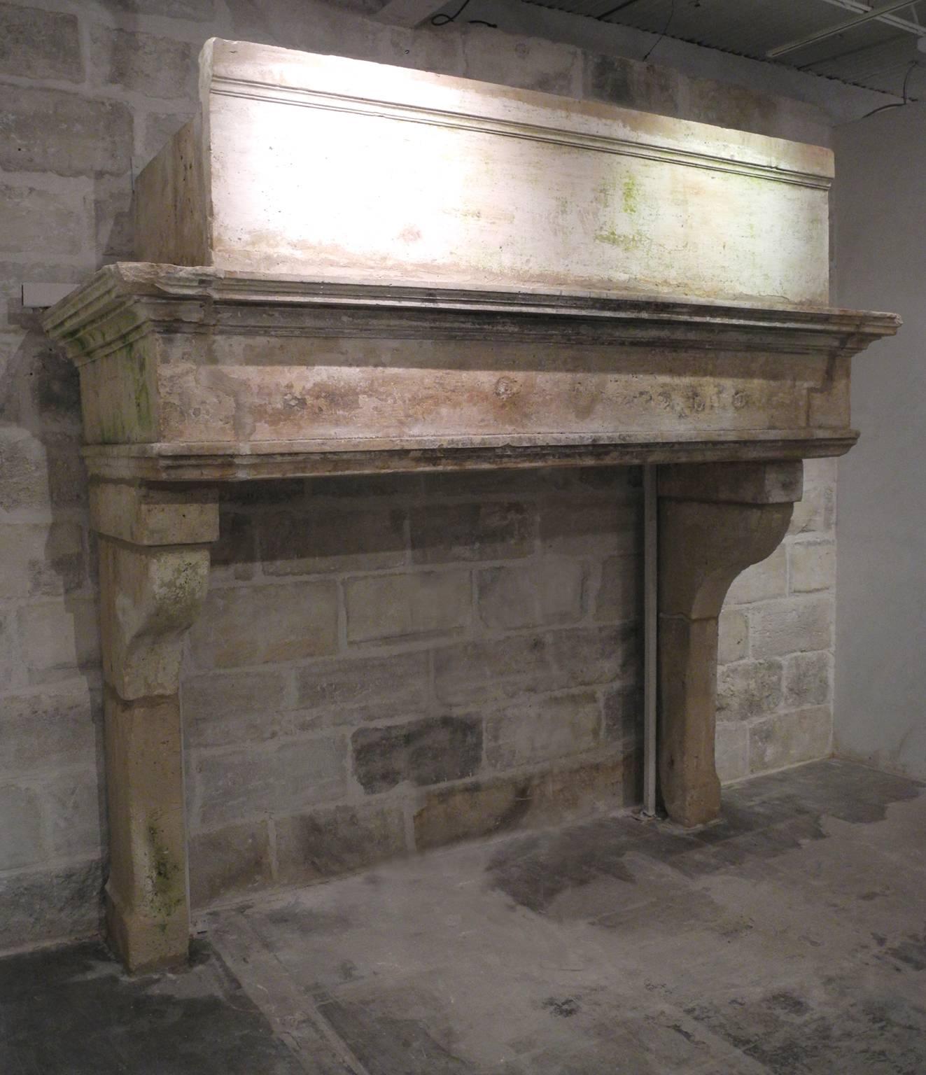 This is a very special antique 18th century fireplace from a grand property in Montmiry-Le-Chateau, a commune in the Jura Department in the Franche-Compte region of France. One of the largest mantels we have carried to date, this piece can serve