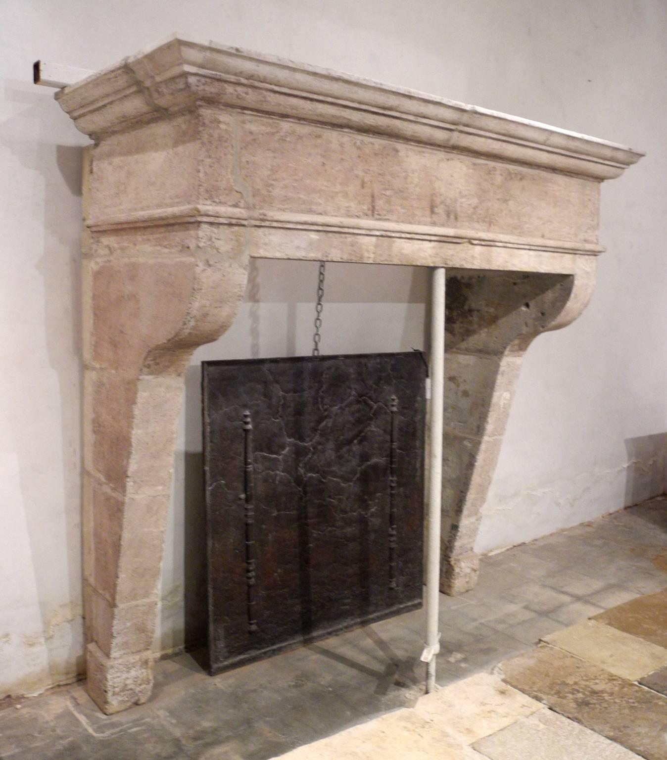 This is a spectacular 18th century mantel from a longère (Brittany style farmhouse) near the Bretagne Commune of Pontivy. It has been beautifully reclaimed, leaving it in it's original rose-hued stone color. It is relatively large; it can be used