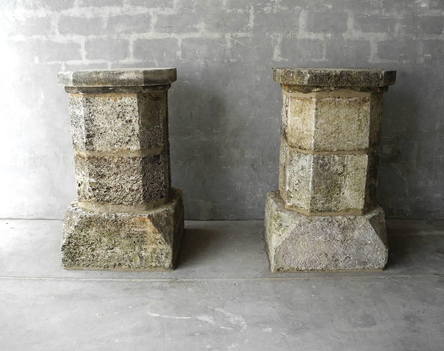 This pair of 17th century stone columns are from the entrance to a domain near Bezier, France. They are made of limestone and have a wonderful mossy patina because of the porousness. They are thick and short - they can flank an entrance or stand as