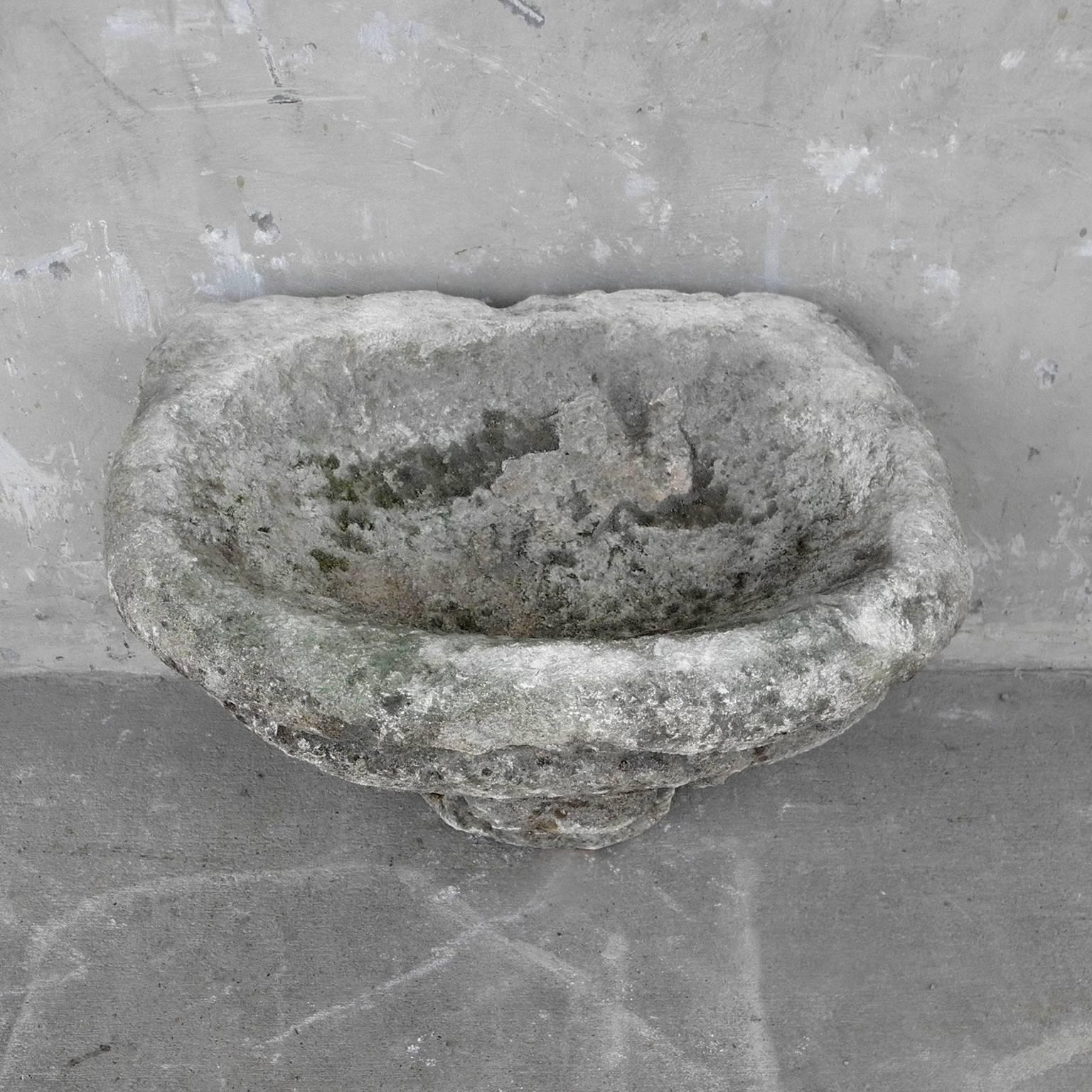This is 17th century baptismal font from Vaucluse in the southeastern part of France. It is made of limestone. It has wonderfully detailed carving, perfect to stand alone in a bathroom space or on another piece as a set. 