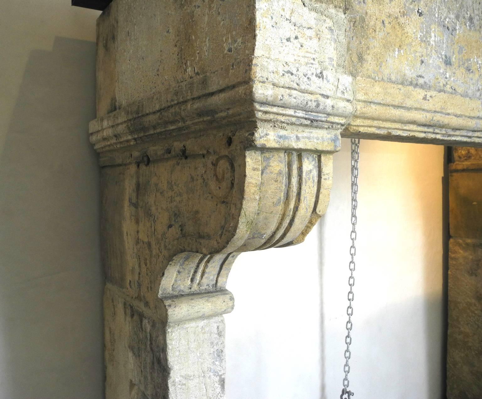 Limestone Antique French Large Stone Mantel with Carved Legs For Sale