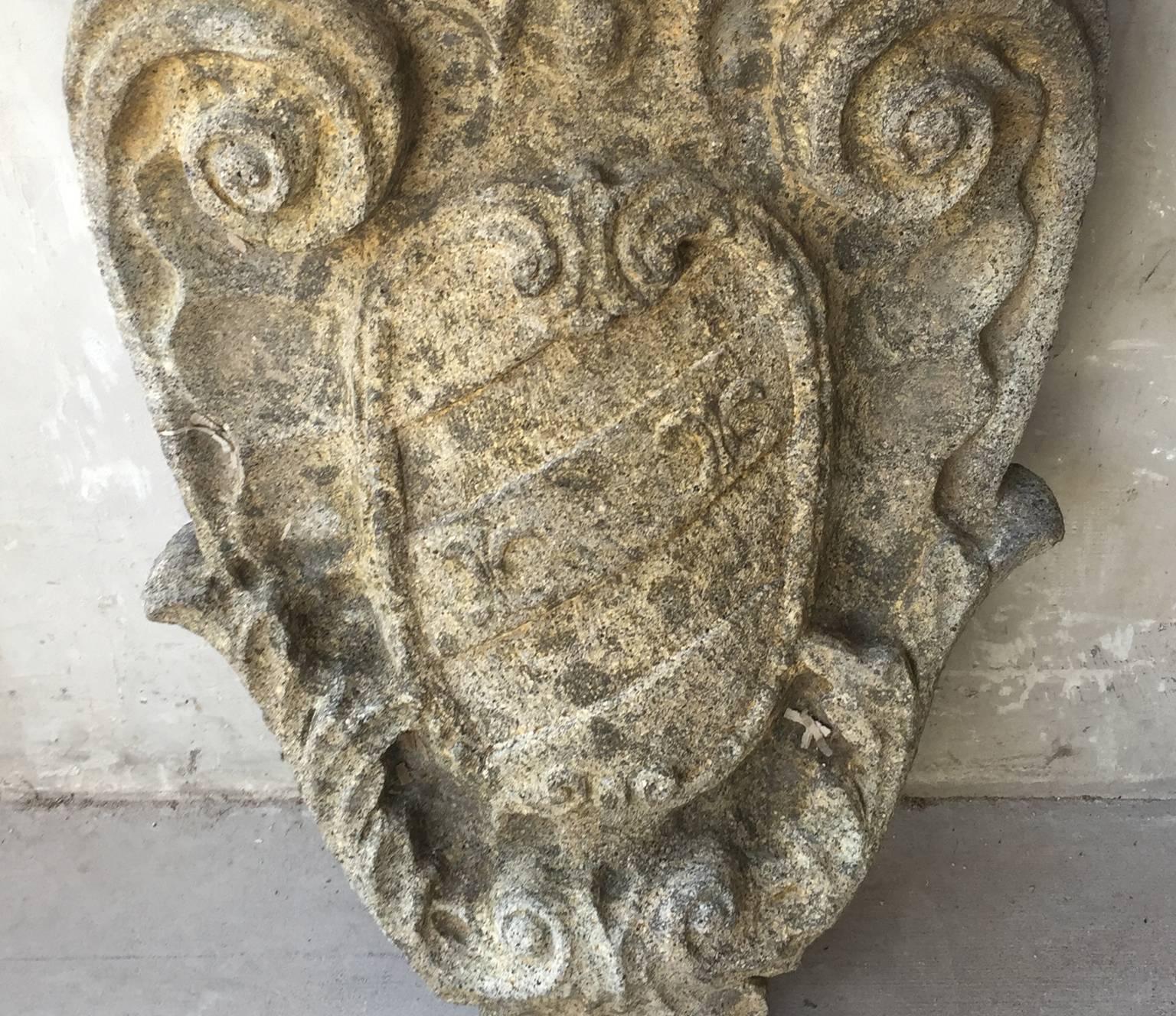 This is a beautiful and intricately carved Louis XVI stone crest element from Umbria. It is relatively large and very durable do to it's heavy stone weight. It has a slightly heart shape with a crown atop. It also has a shield type carving on the