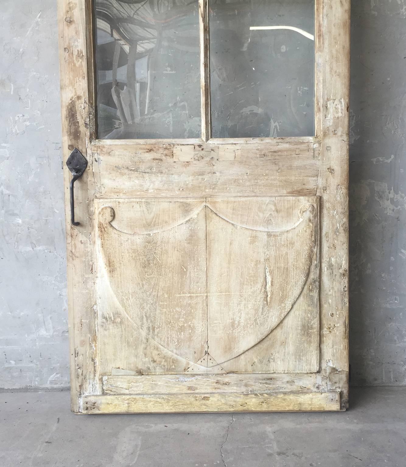 Antique French Walnut Door with Glass and Original Handle and Carved Bottom In Good Condition In Houston, TX