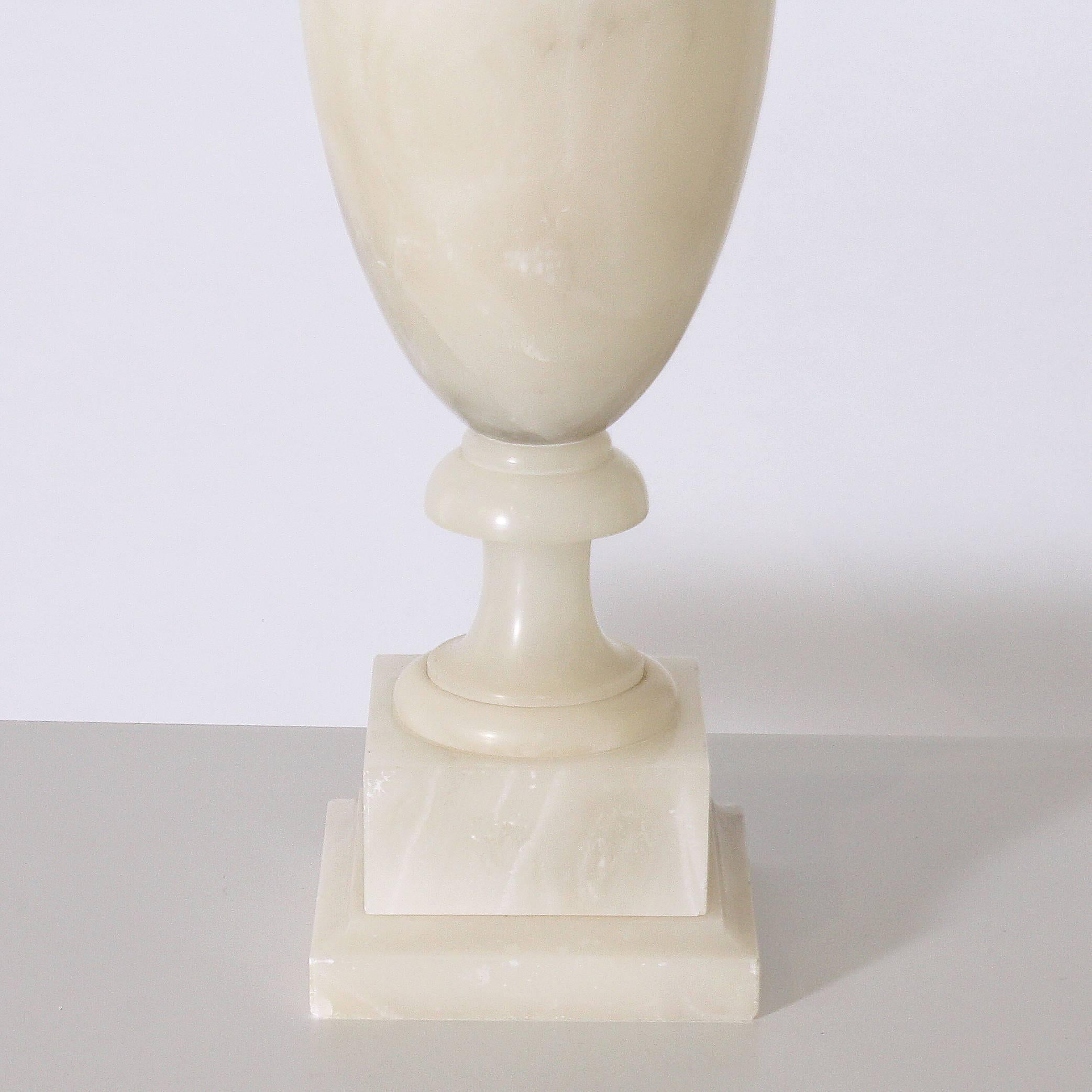 This beautiful alabaster table lamp stands 36" tall and has a pleated shade.