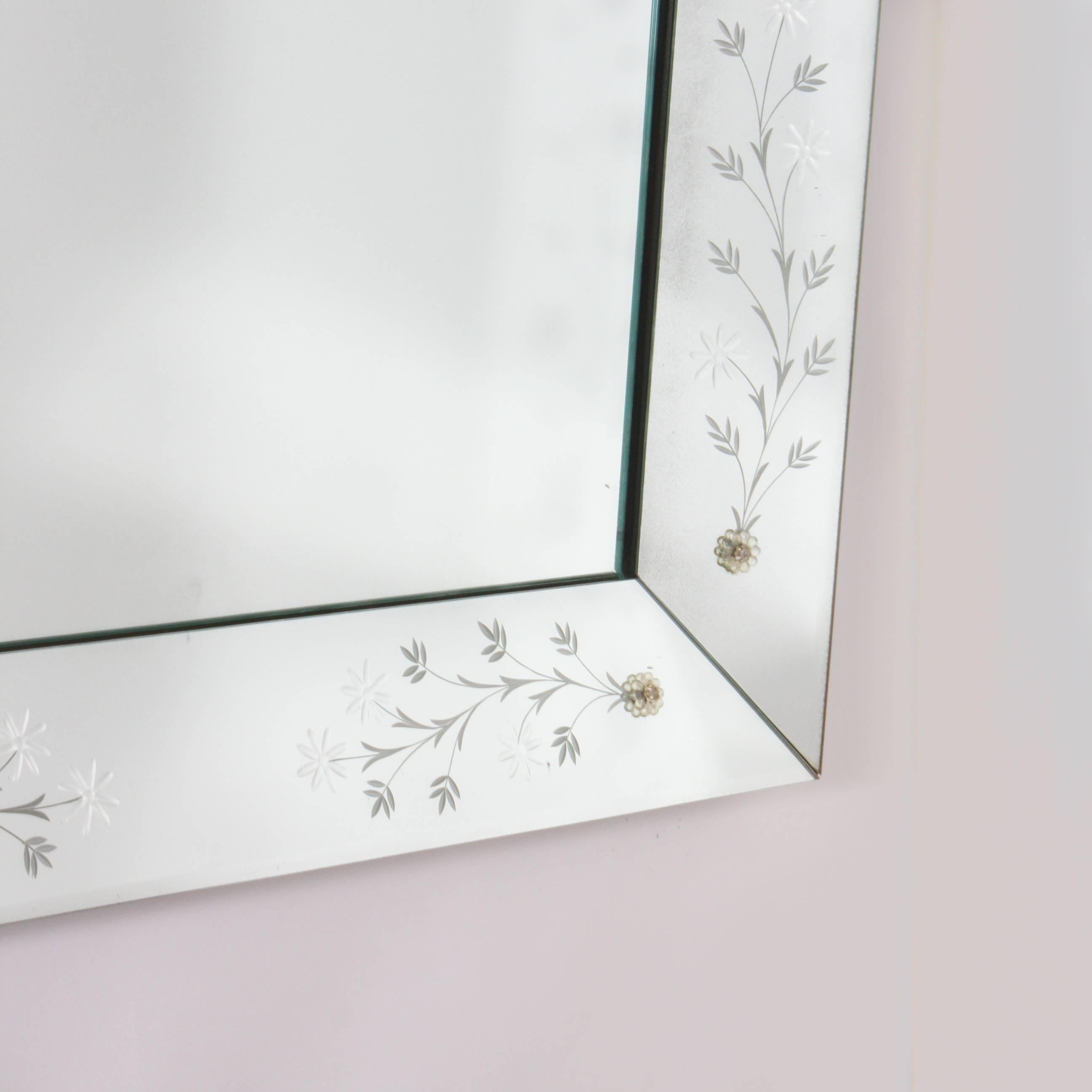 Large mirror frame mirror with flower etching and rosettes.