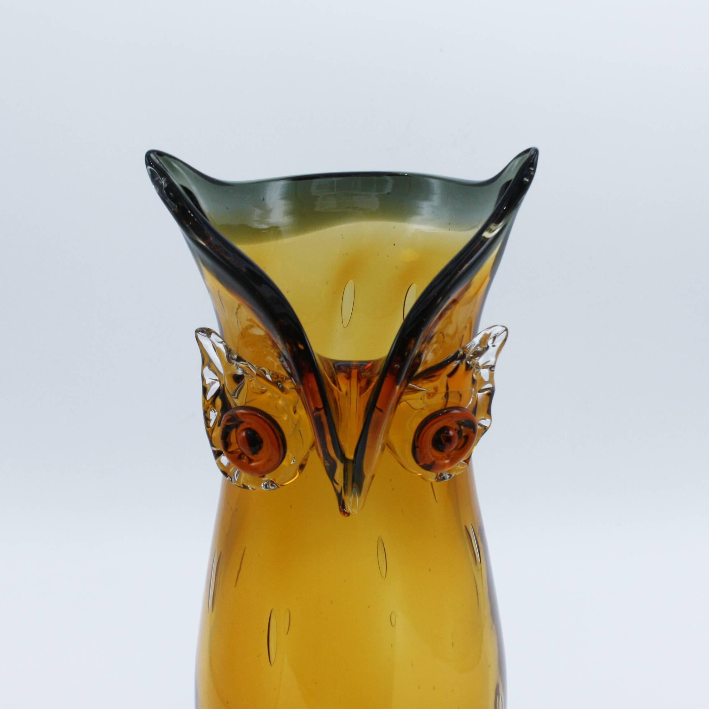 Amber owl Murano glass vase with clear bubble inclusions.
  
