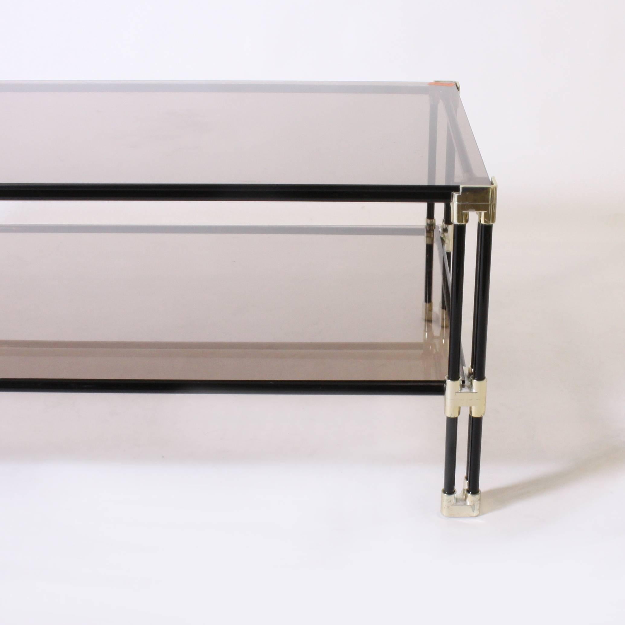 Silver plated and black metal coffee table with glass tops.
 
