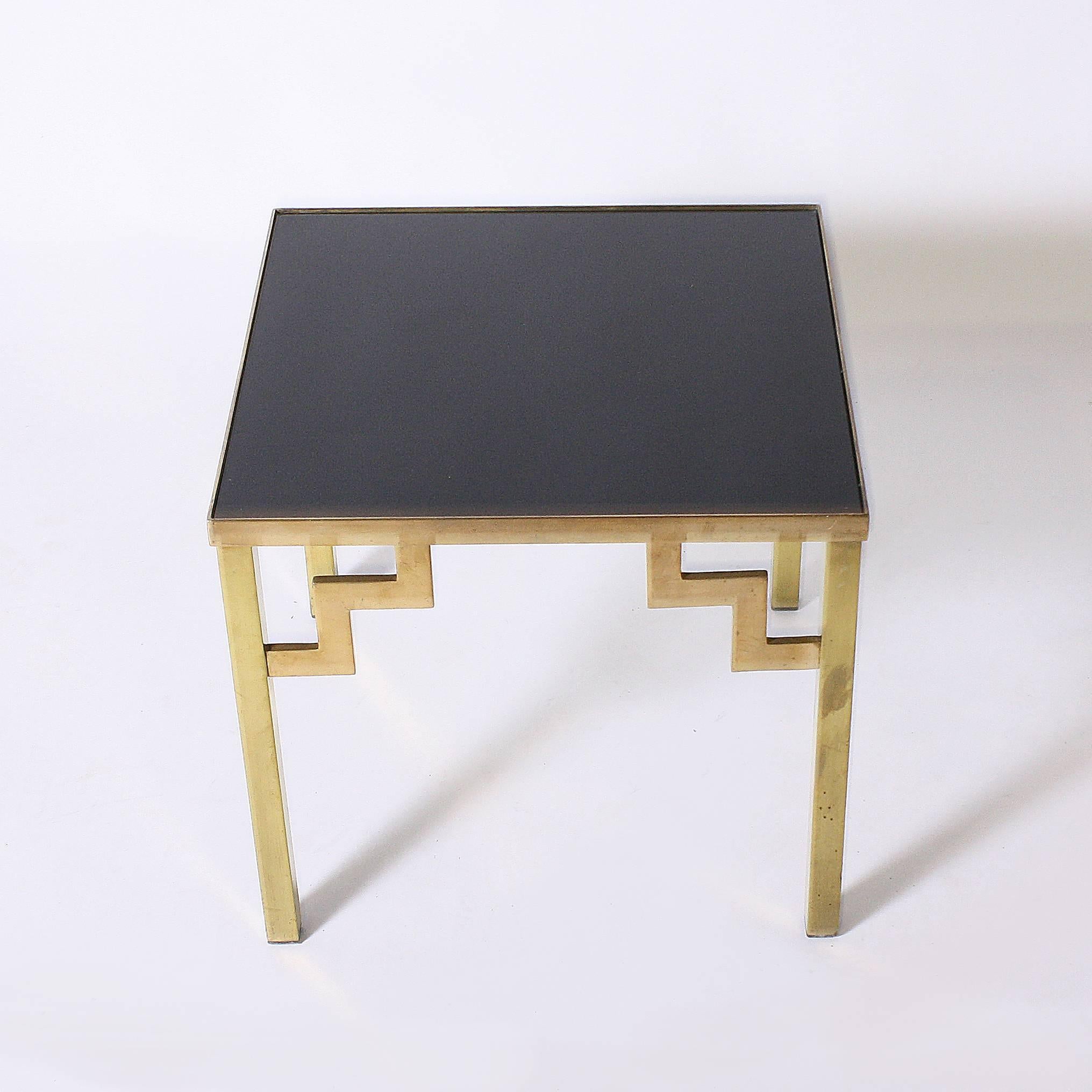 Pair of brass side tables with opaline glass tops.