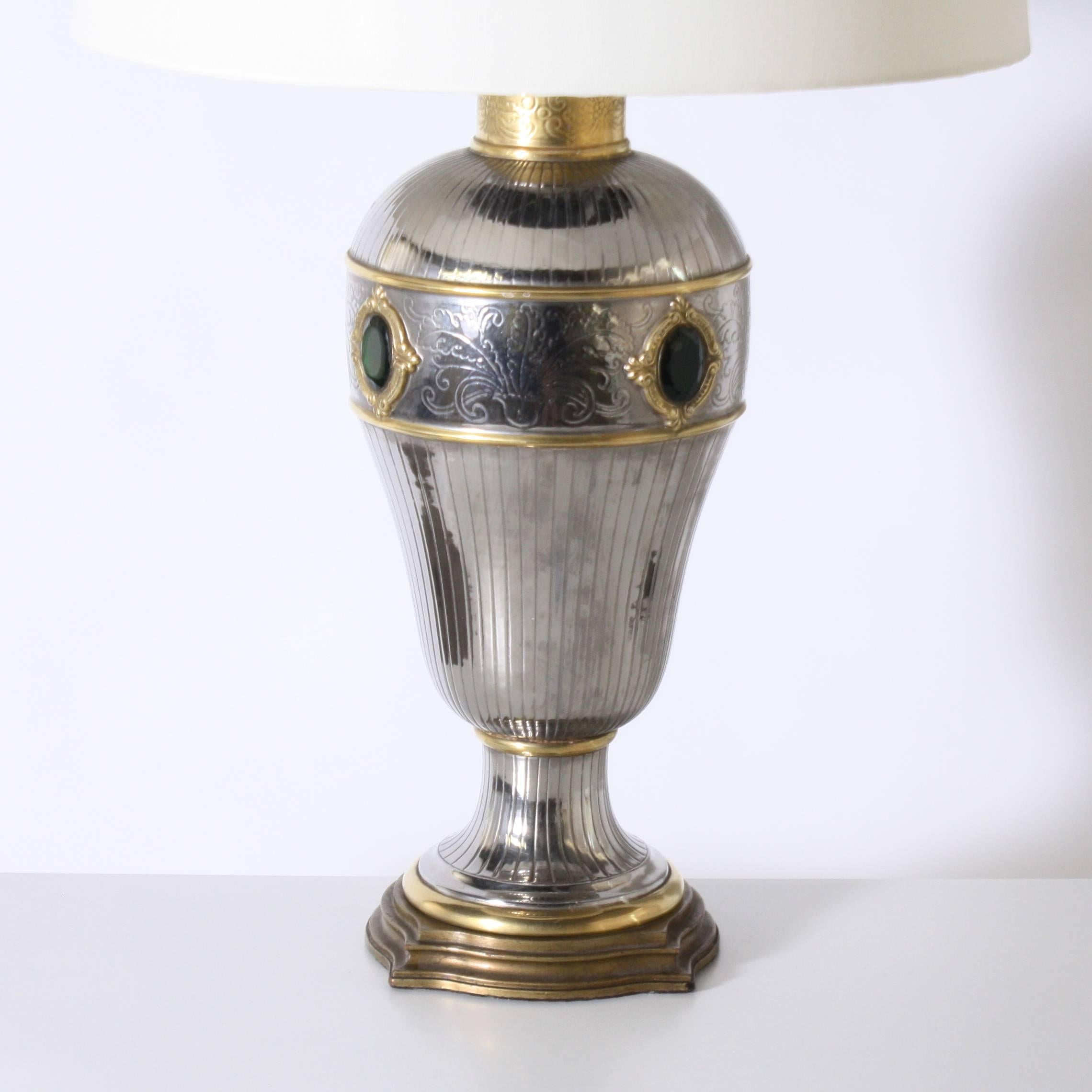 Monumental silver and brass Marbro lamp with faux emerald detail, circa 1950

Shade is 20" diameter X 32 1/2" overall height