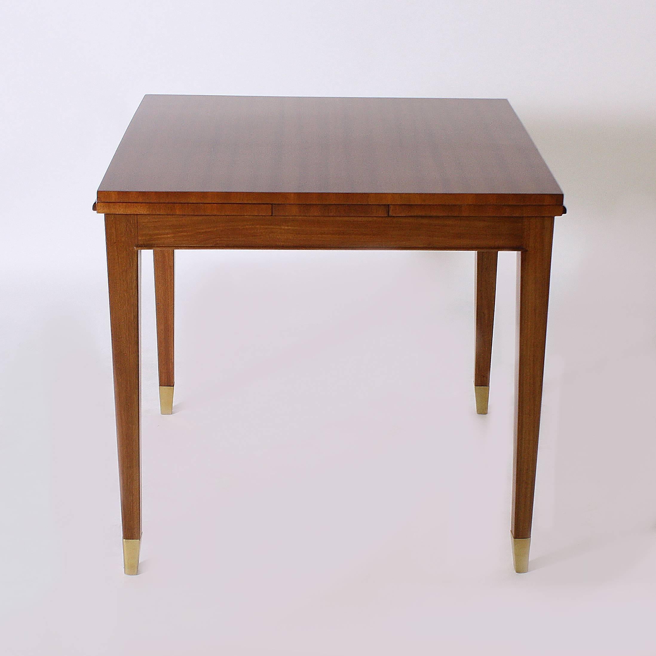This French game table has been beautifully refinished in its original merisier finish. The brass sabots give this game table an elegant and glamorous look. 
Measures:
31 5/8” W x 31 1/2” D x 29 3/4” H
When expanded, this table is 56 1/4