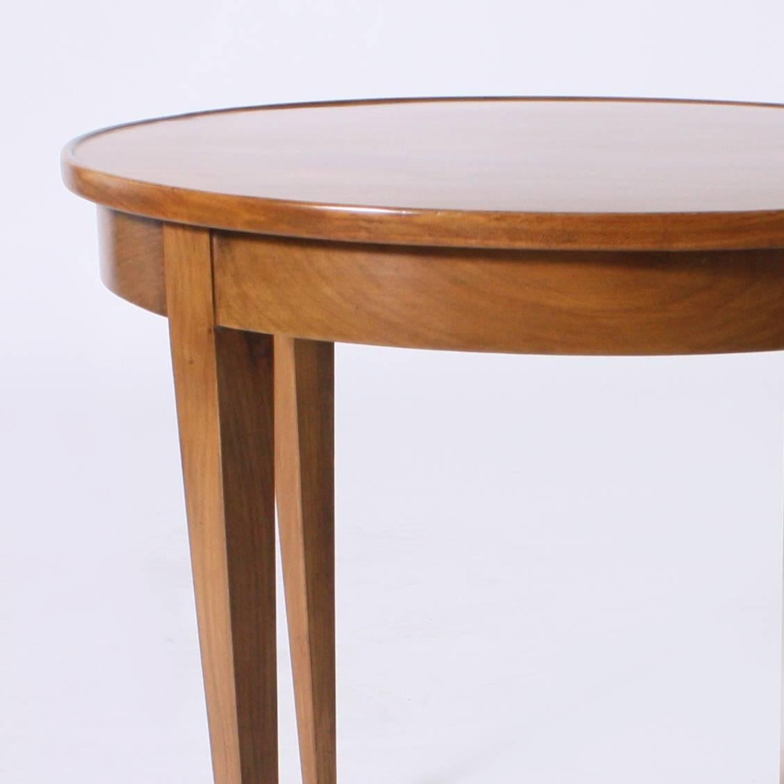 This French small round cigarette table with brass sabots has been beautifully restored in its original Merisier finish.