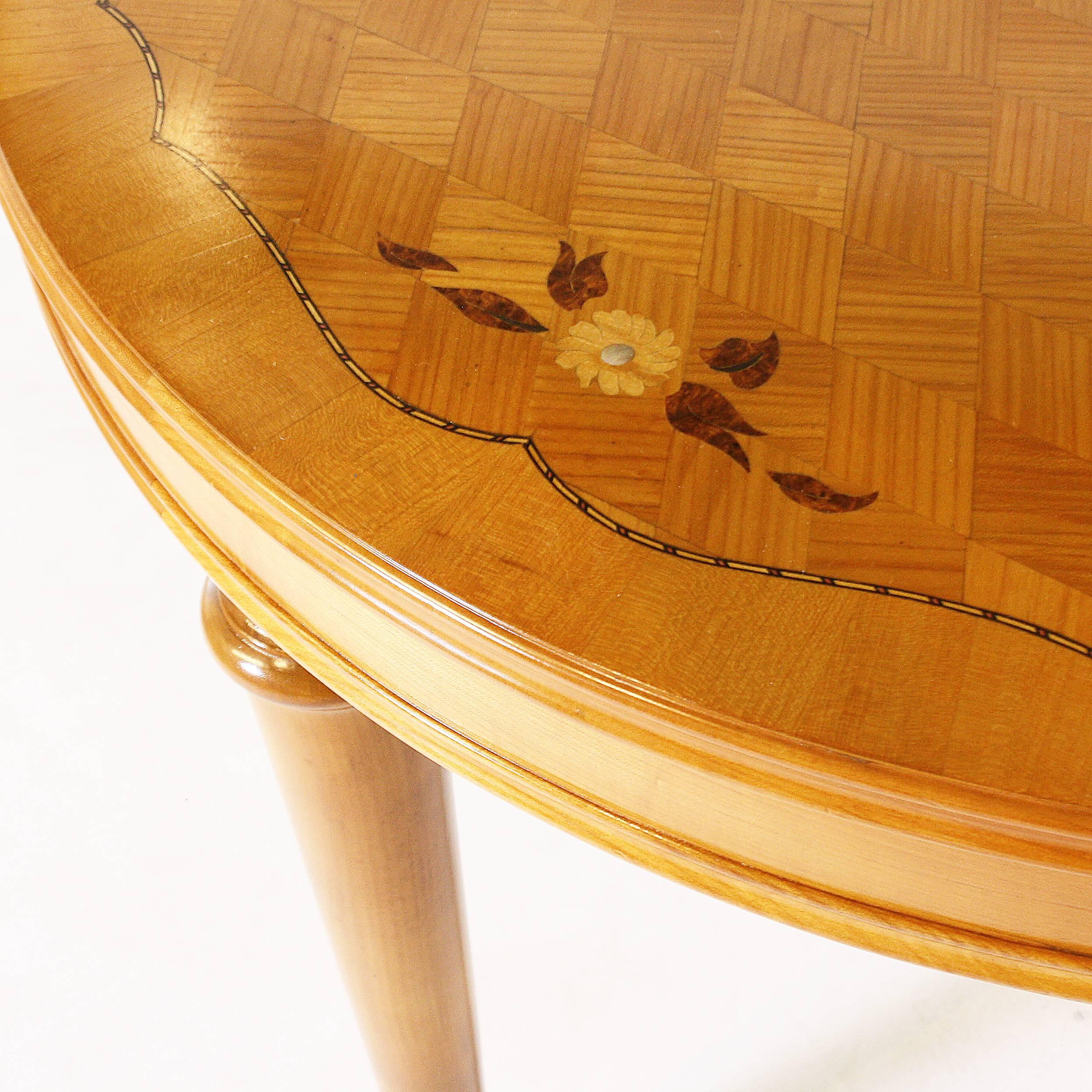 This French table has a beautifully restored marquetry top with mother-of-pearl detail.