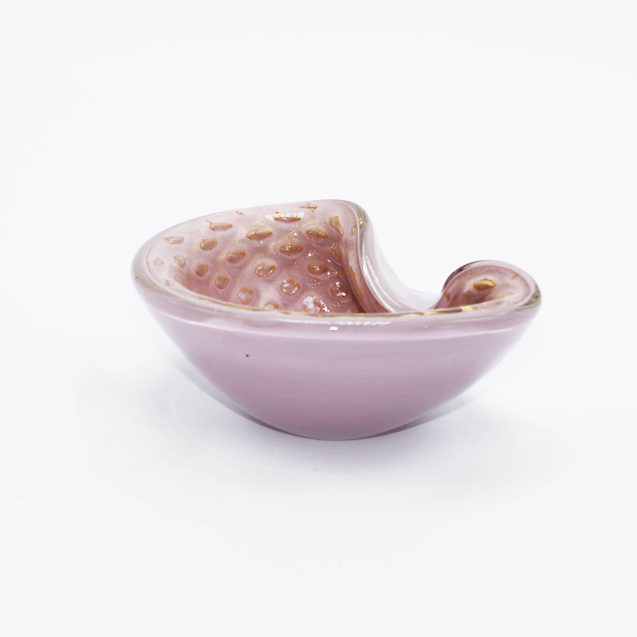 Pink Murano glass bowl with gold bubble inclusions in the style of Barbini, circa 1950.
 