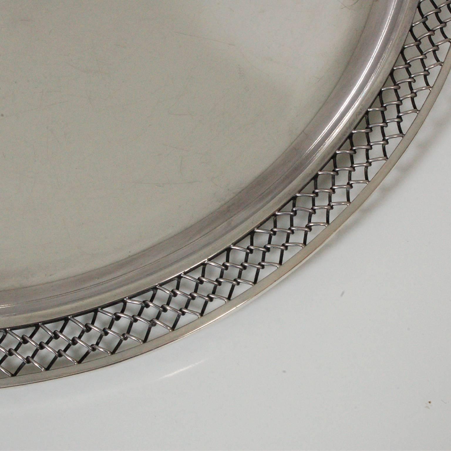 Large platter or tray designed by Svend Weihrauch for Hingelberg Studios. Sterling silver hammer made, with polished top. Chain link decoration edging, stamped on bottom with manufacturer's and silver mark.
Silver weight 3.3 kg/7.2 lbs.