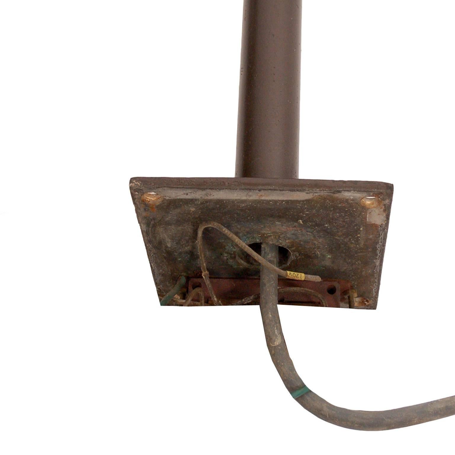 These lamps were created for the grounds of the Amon Carter Museum in Ft. Worth TX by Johnson. They are enamel painted bronze with a drum shaped top and platform base. Several available.