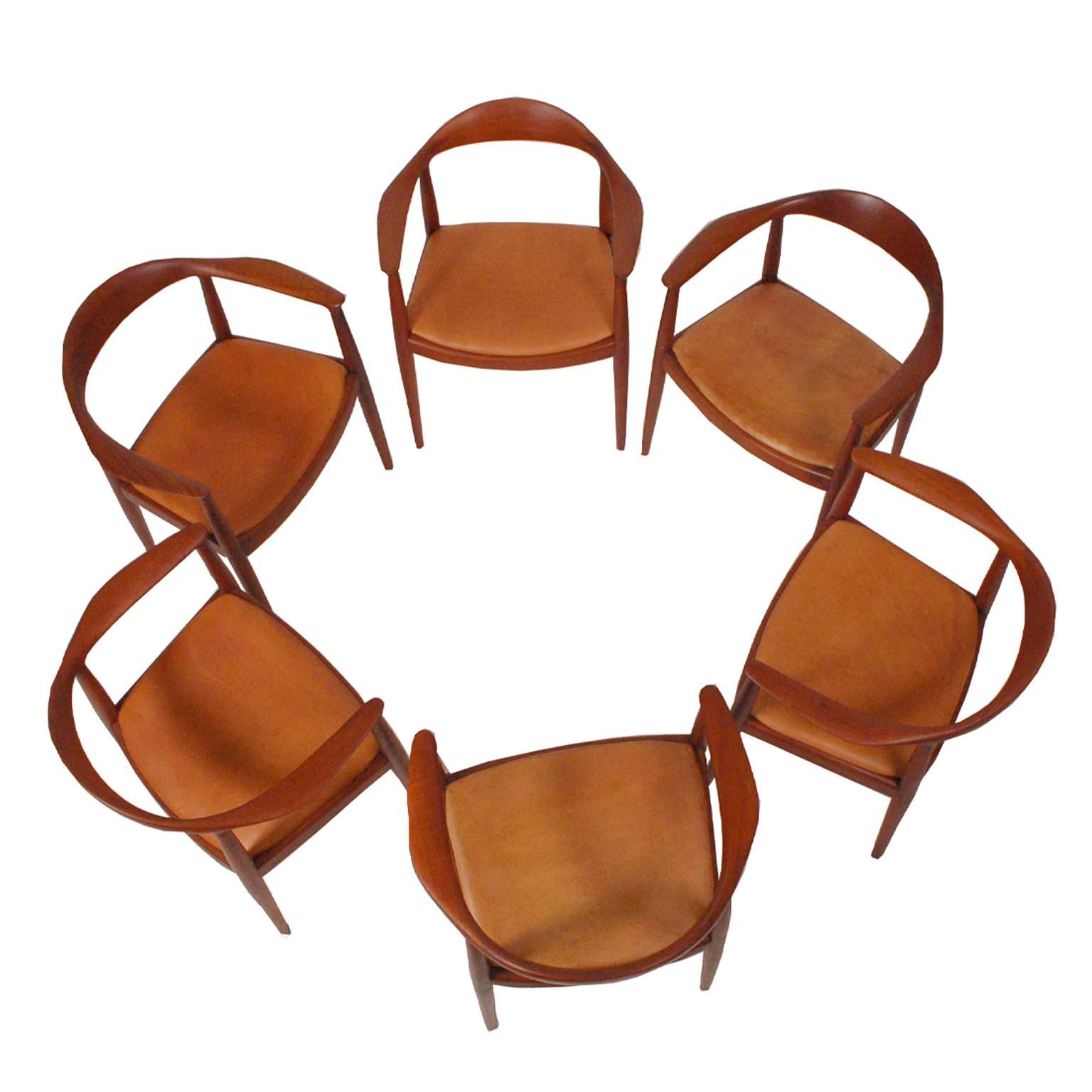 Solid teak Hans Wegner Classic chairs all with impress signature JH and some with Knoll label, natural leather upholstery.